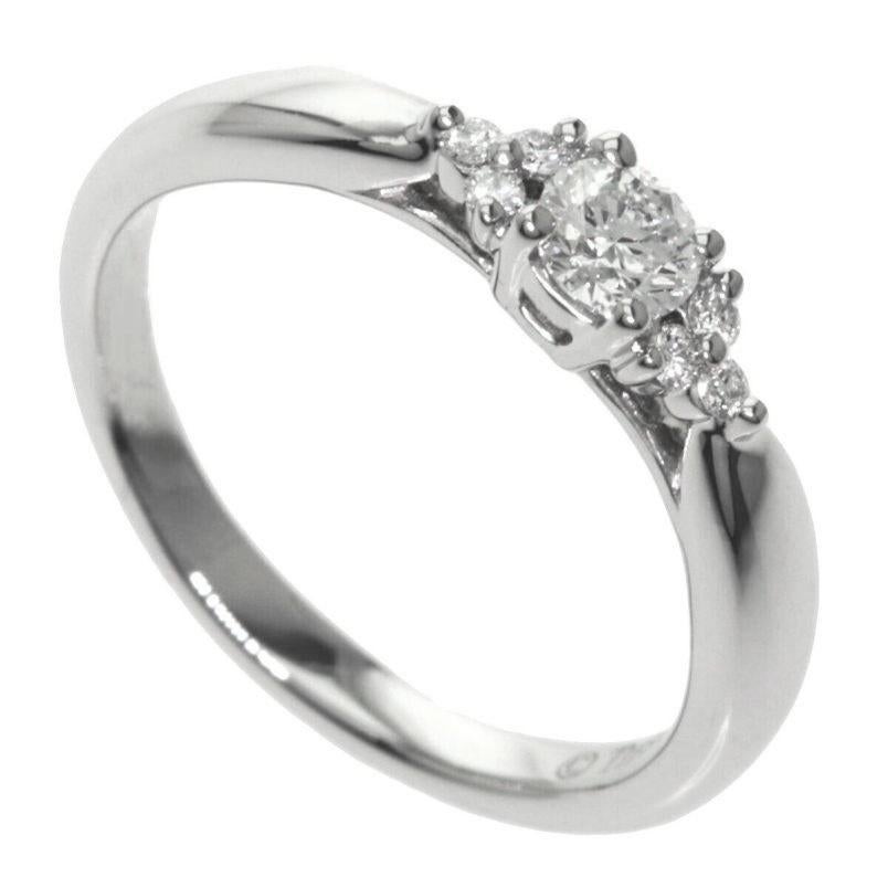TIFFANY & Co. Harmony Platinum Diamond Ring with Side Stones 7.25

Metal: Platinum
Size: 7.25
Weight: 3.90 grams
Center diamond: 1 round brilliant diamond, carat total weight .15, D-F color, IF-VS clarity
Side diamonds: 6 round brilliant diamonds,
