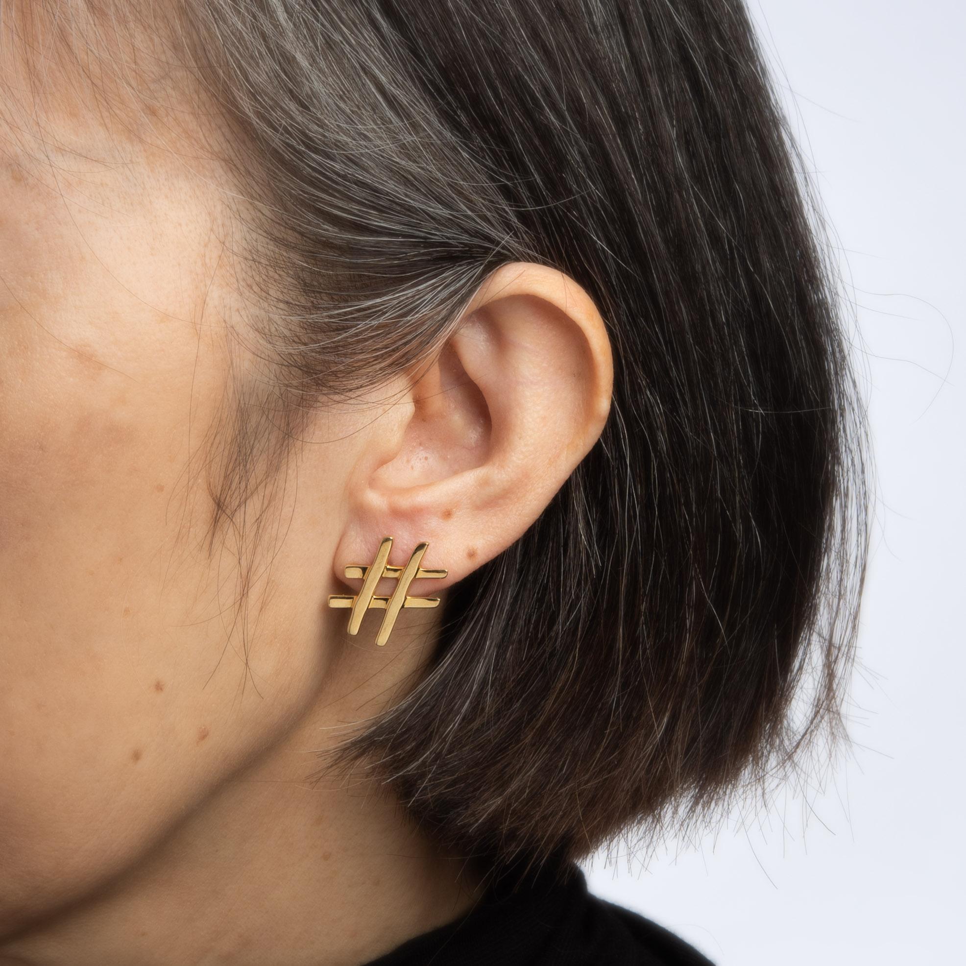 Finely detailed pair of vintage Tiffany & Co hashtag earrings crafted in 18k yellow gold (circa 1980s). 

The symbol (#) is known as the number sign, hashtag or pound sign and so relevant back in the 1980s as it is today. The earrings are fitted