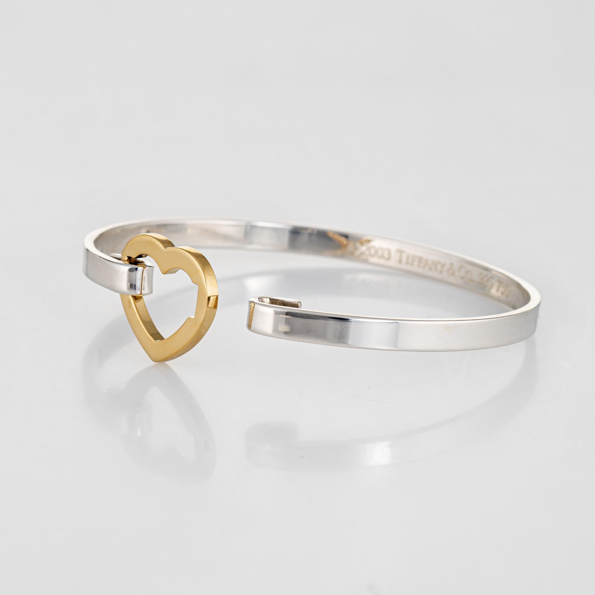 Stylish and finely detailed vintage Tiffany & Co bracelet crafted in sterling silver with an 18k yellow gold heart.  

The bracelet features a push closure that hooks securely into the heart. The bracelet is great worn alone or layered with your