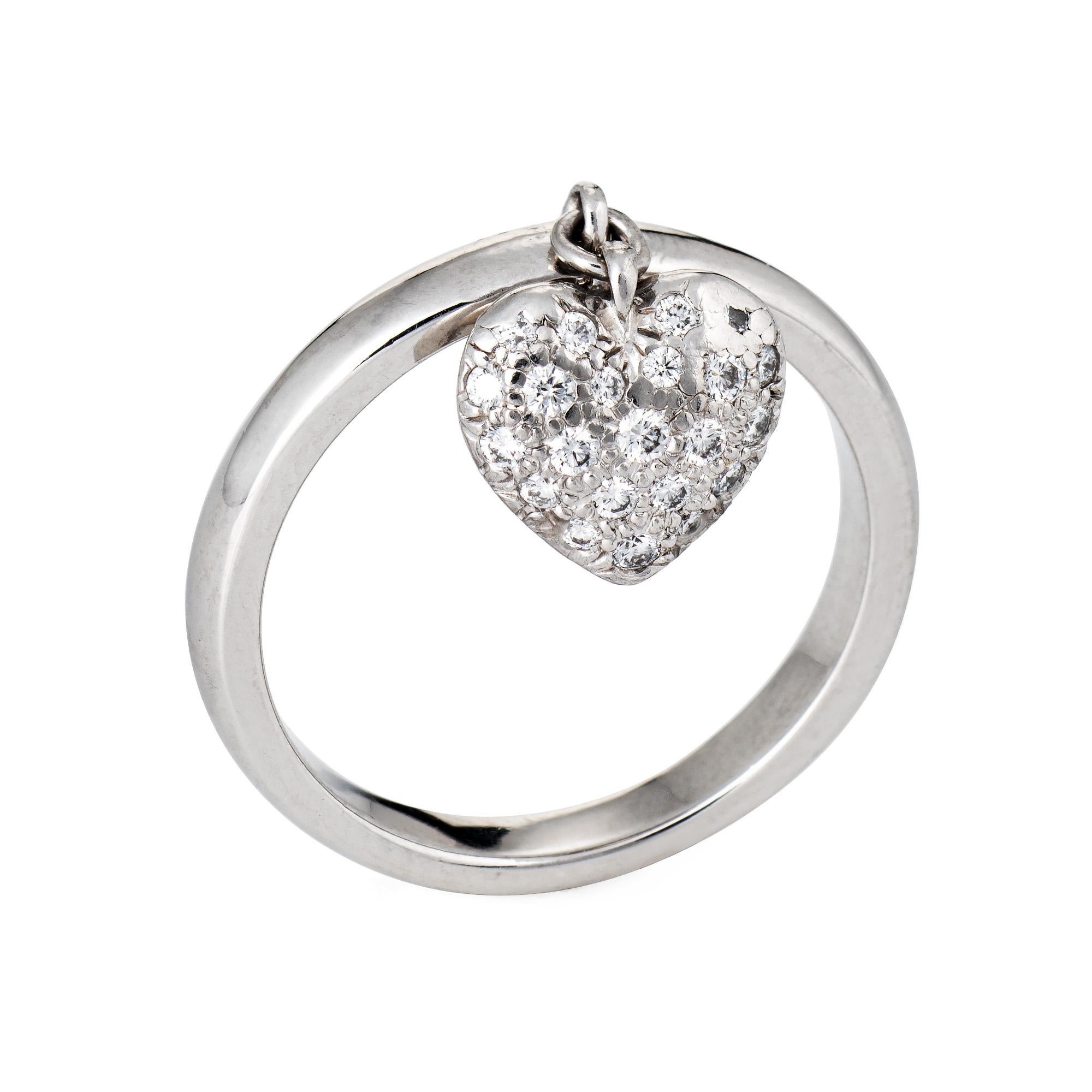 Finely detailed pre owned Tiffany & Co pave diamond heart charm ring crafted in platinum. 

Diamonds are pave set into the heart and total an estimated 0.20 carats (estimated at F-G color and VVS2 clarity).  

The stylish ring features a diamond set