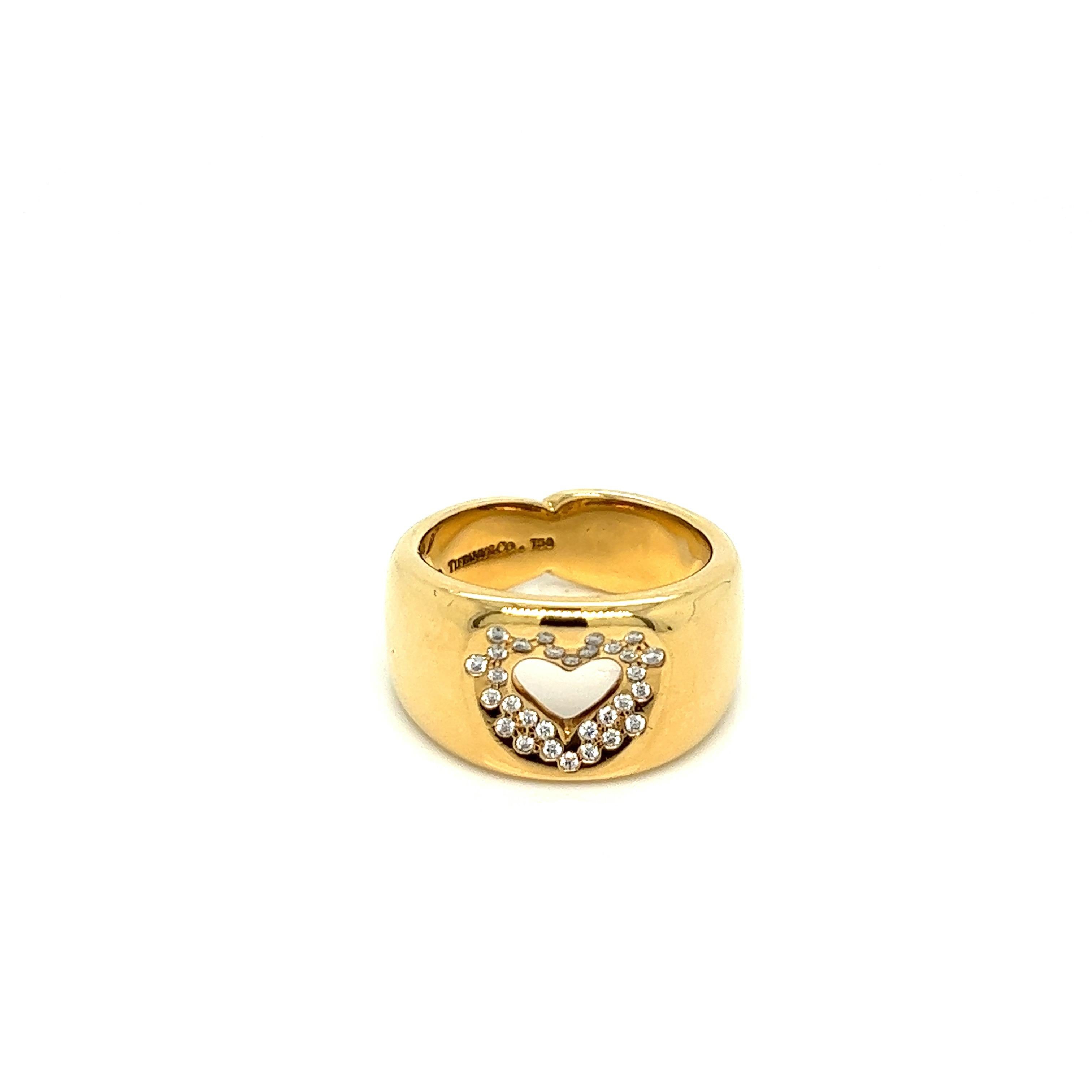 Tiffany & Co. heart diamond gold ring

Round-cut diamonds of approximately 0.30 carat, 18 karat yellow gold; marked Tiffany & Co., 750

Size: 6.75 US, width 11.5 mm
Total weight: 13.7 grams