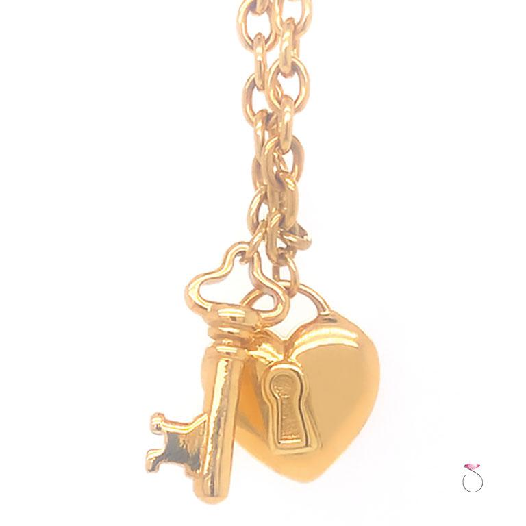 Tiffany & Co. Heart & Key Charm Bracelet in 18K Yellow Gold In Good Condition In Honolulu, HI