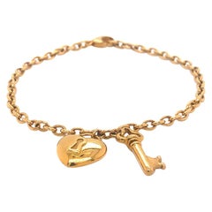 Tiffany & Co. Heart & Key Charm Bracelet in 18K Yellow Gold