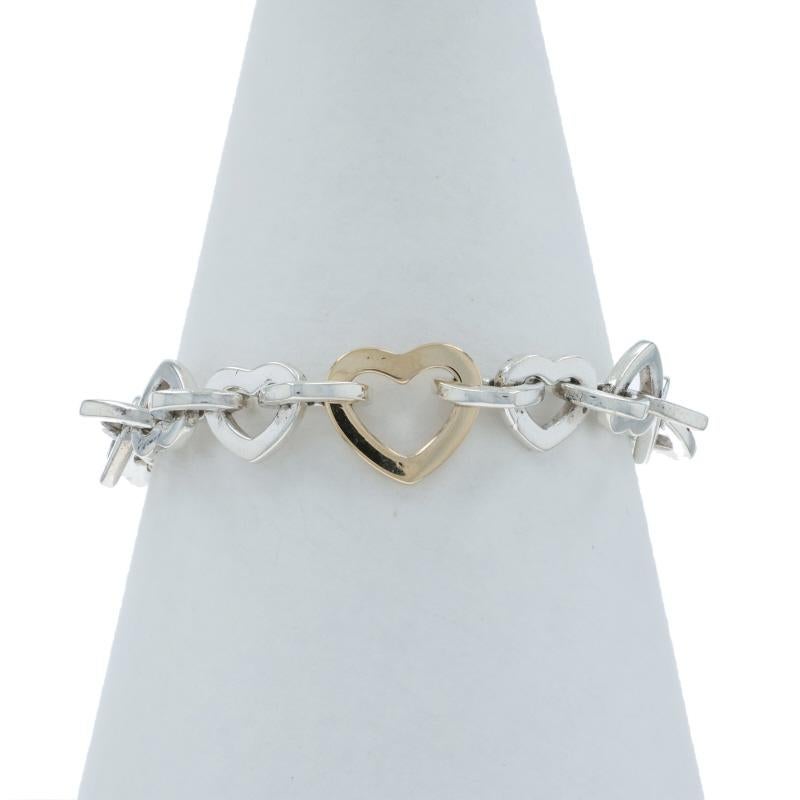 Marca: Tiffany & Co.
Diseño:  Pulsera de eslabones corazón

Contenido de metal: Plata de ley y oro amarillo de 18 quilates

Estilo de pulsera: Eslabón
Tipo de cierre: Cierre deslizante
Tema: Amor, Corazones

Medidas

Ancho de la cadena: 13/32