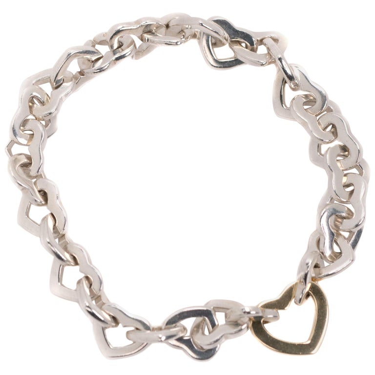 Tiffany and Co. Bracelet à maillons en forme de cœur en argent sterling et  or jaune 18 carats En vente sur 1stDibs