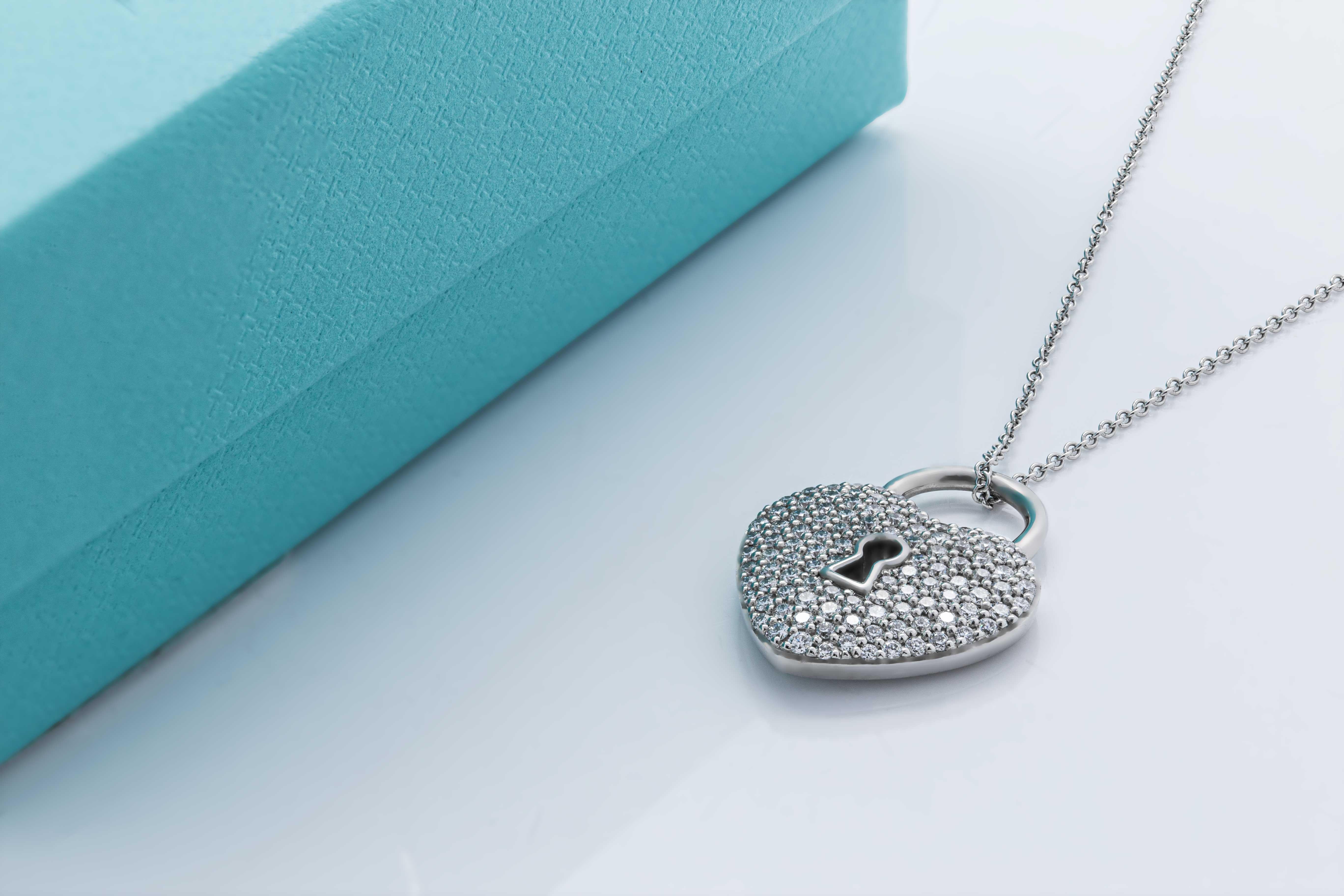 Tiffany & Co. Heart Lock Diamond Paved Platinum Pendant
Authentic Tiffany Piece -  Rare Find!
Total carat weight of diamonds: ~0.75ct (F-G VVS)
Chain length: 17 inch (platinum)
Charm dimensions: 18.05x16mm
Weight: 11gr
Comes in original box w/