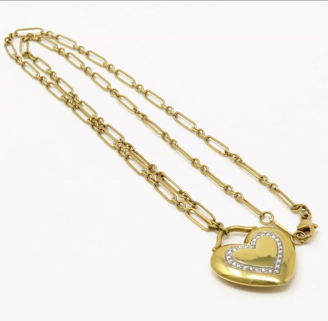 Tiffany & Co. pprox 0.3ct TW, most about F-G and VS range

Necklace 18 inches long and 2mm wide, marked Tiffany & Co. 750. Pendant 23 x 20mm, marked Tiffany & Co. 750

Total Weight : 19.3 grams


