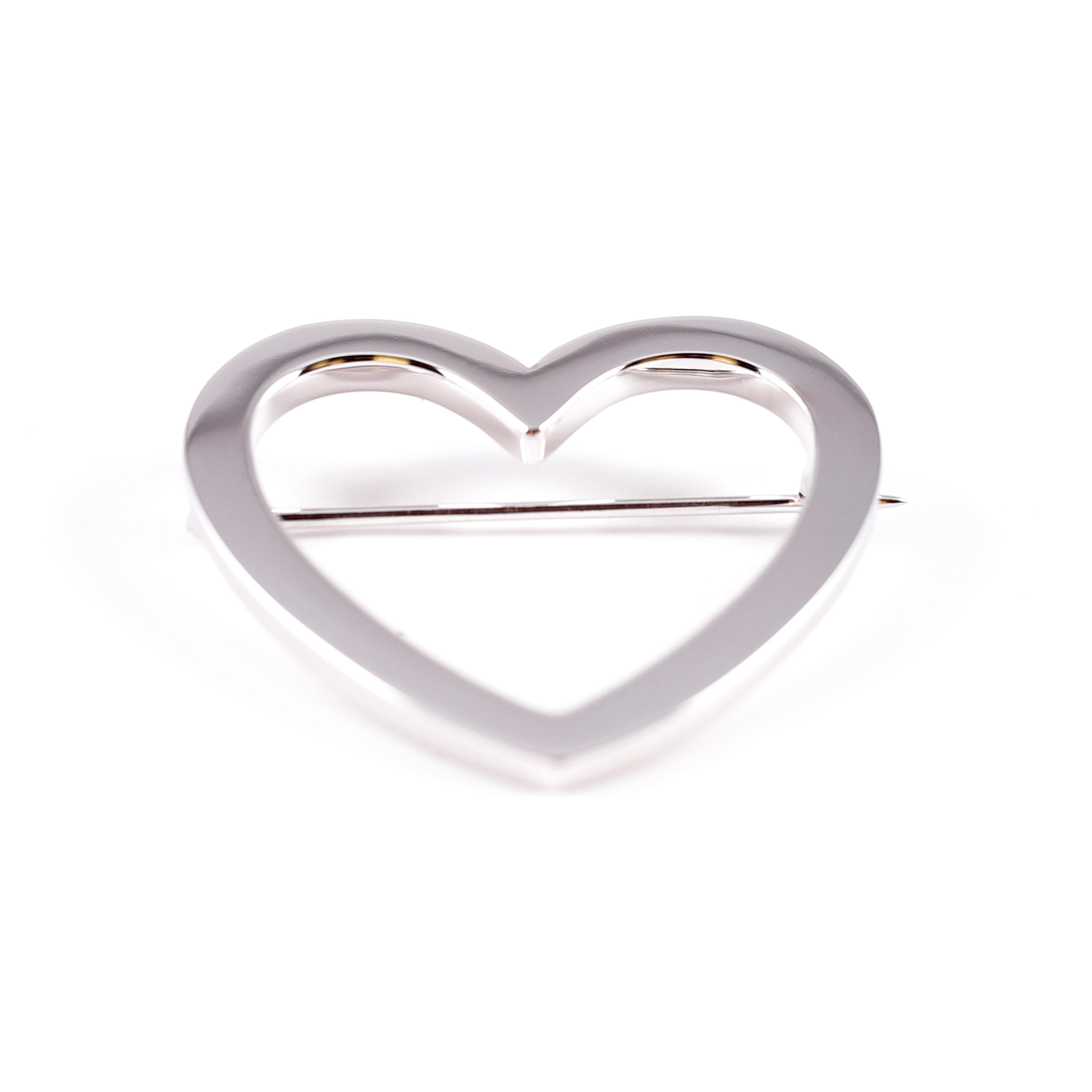 Simply elegant heart pin from Tiffany & Co. in 18 karat white gold.  The heart is a perfect gift for your sweetheart or for yourself!