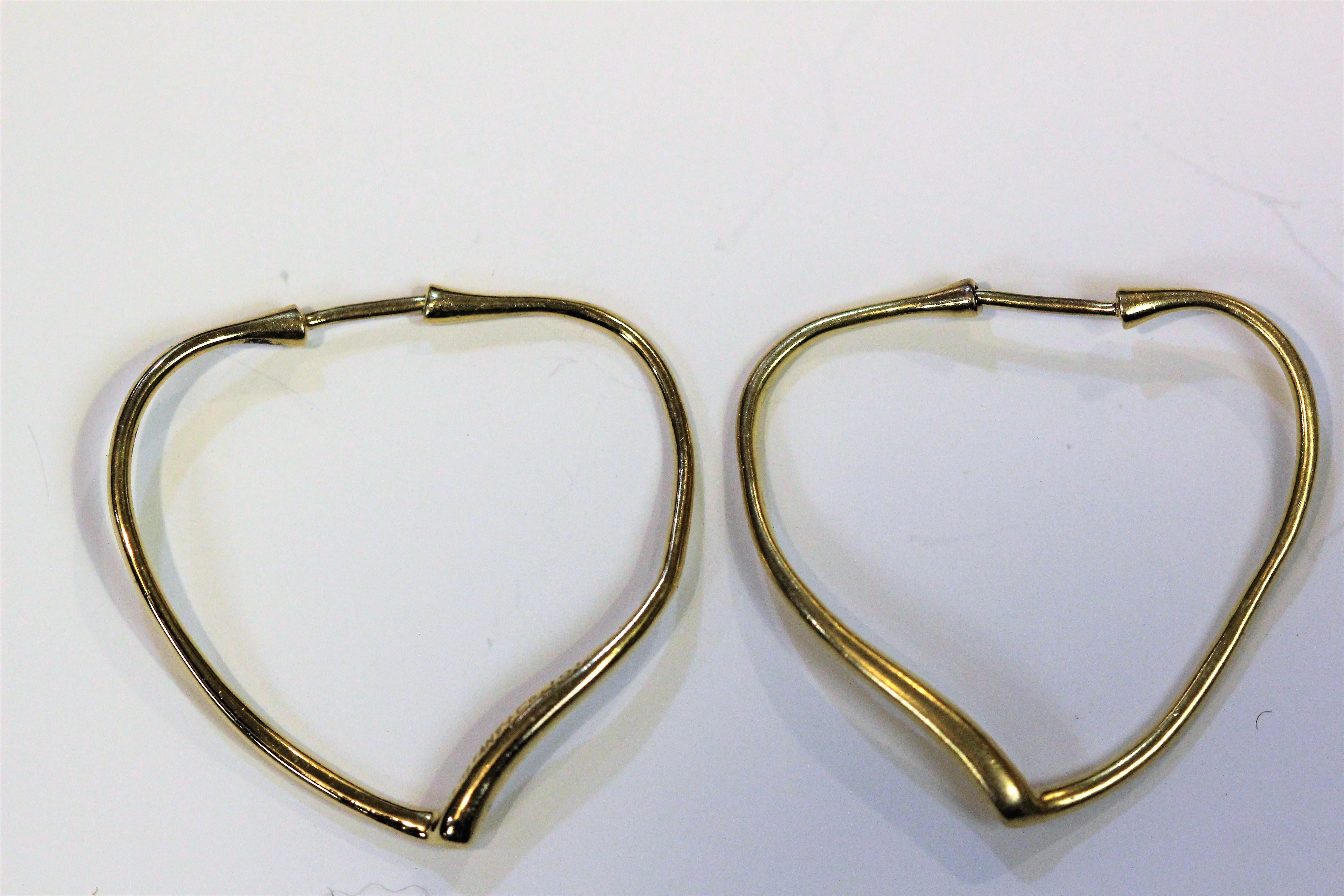 Tiffany & Co.  Heart Shape Earrings by  Peretti , Circa 1980'S 
Measurements: 32.5 long x 32.5 wide mm
Made in 18 karat yellow gold.
Stamped and hallmarked.
Weight 5.5 grams
Note:  The earrings have not been published, but will be happy to do them