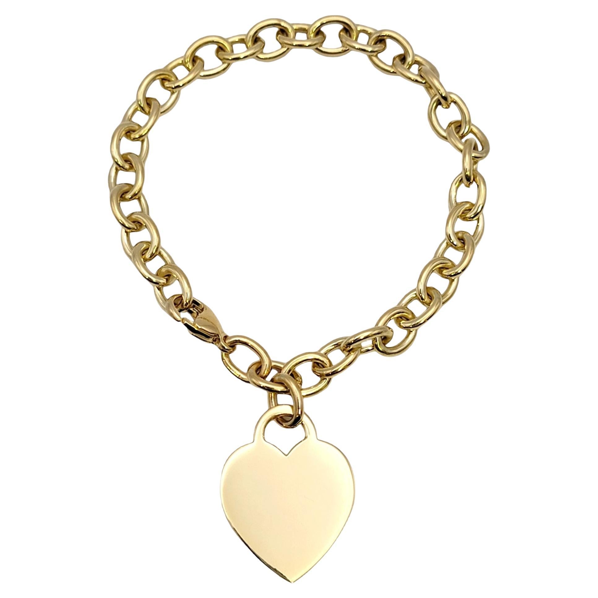 Tiffany & Co. Bracelet à maillons avec étiquette en forme de cœur en or jaune poli 18 carats en vente