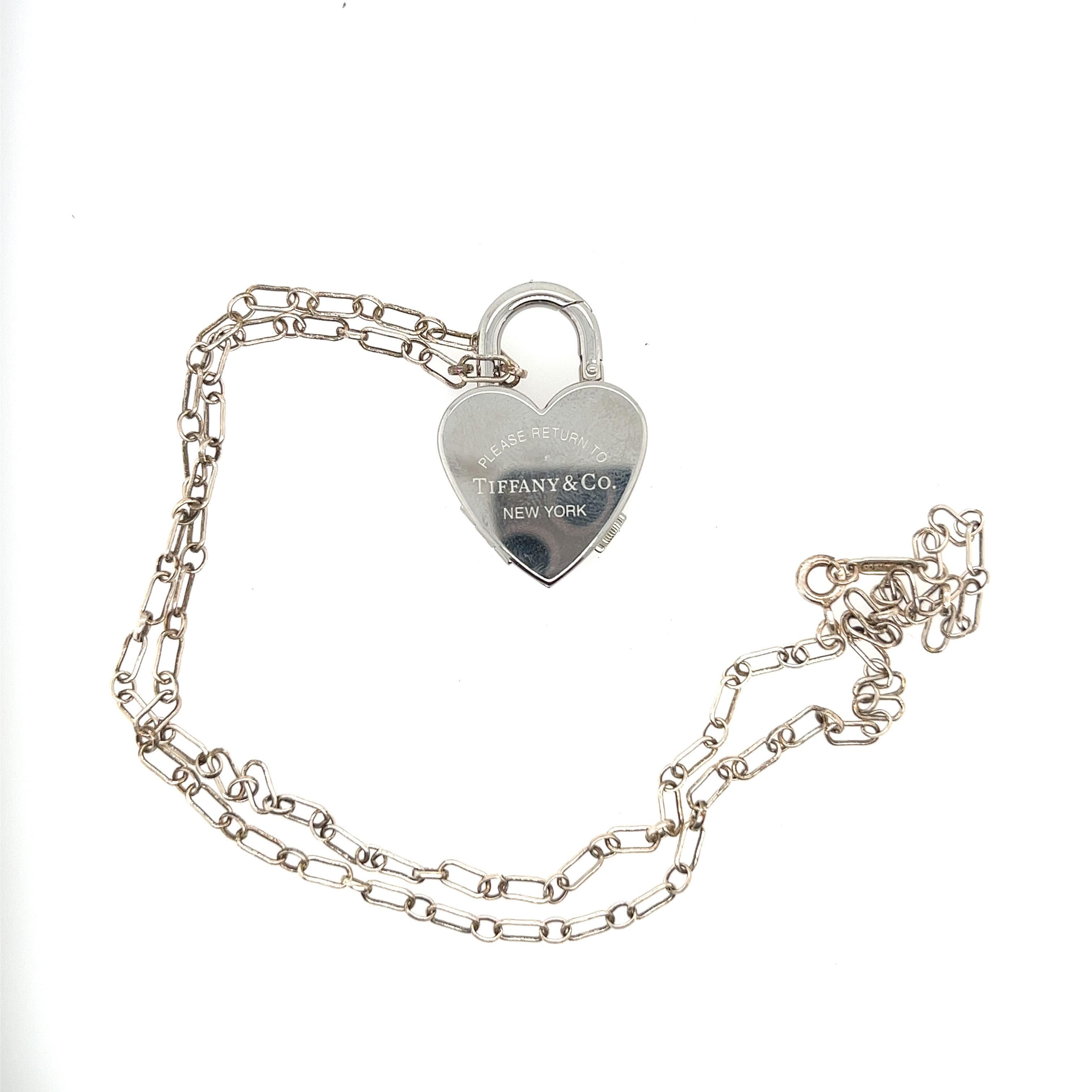 From Return to Tiffany Co comes this unique piece. It is made of 925 sterling silver with Swiss made stainless steel.
Comes with a chain link necklace and removable padlock watch charm. Engraved on the back with Tiffany & Co trademark. It has a