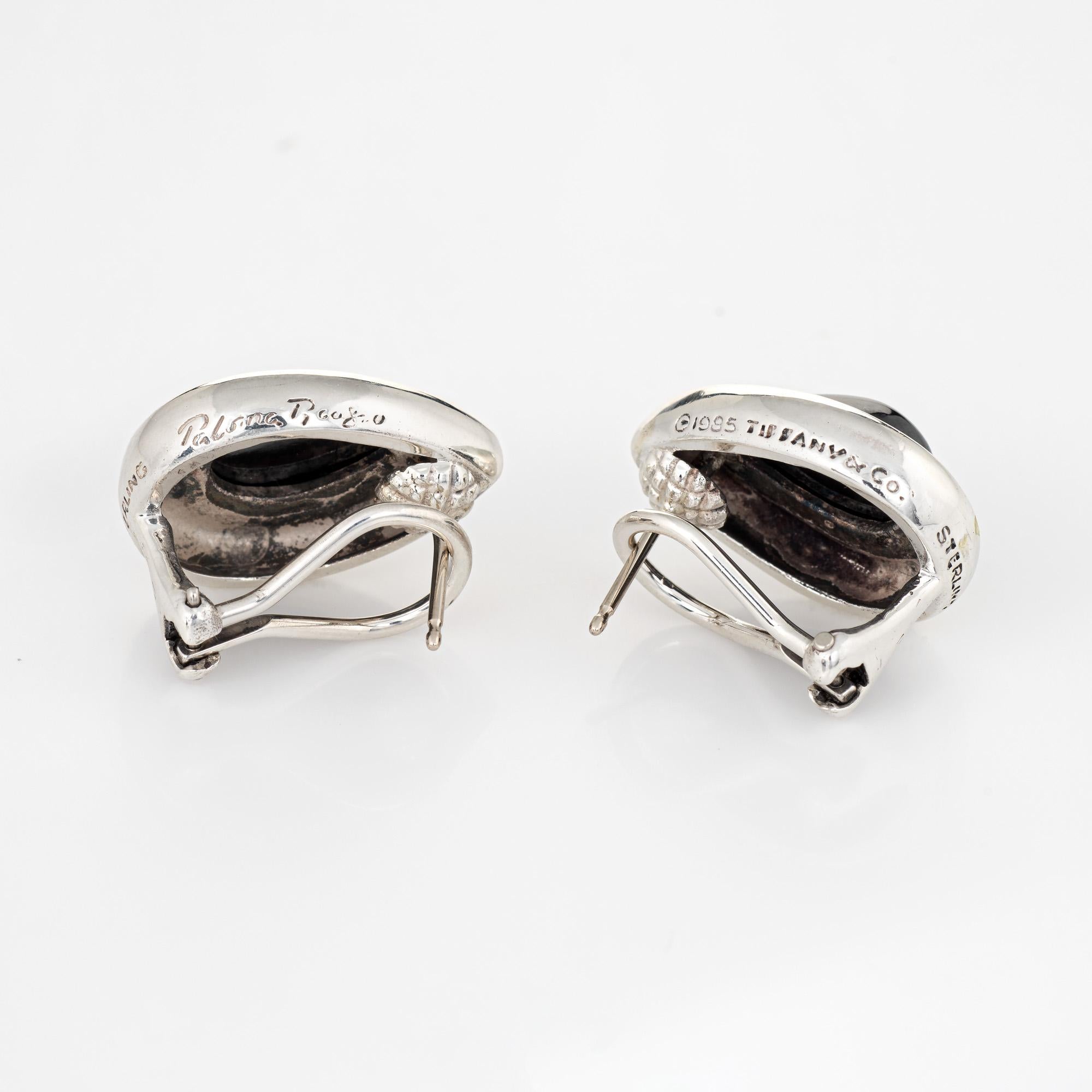 Elegant pair of vintage Tiffany & Co hematite earrings (circa 1995) crafted in 18k yellow gold. 

Hematite measures 12mm x 7.75mm (in excellent condition and free of cracks or chips). The earrings are fitted with post and hinged omega backings for