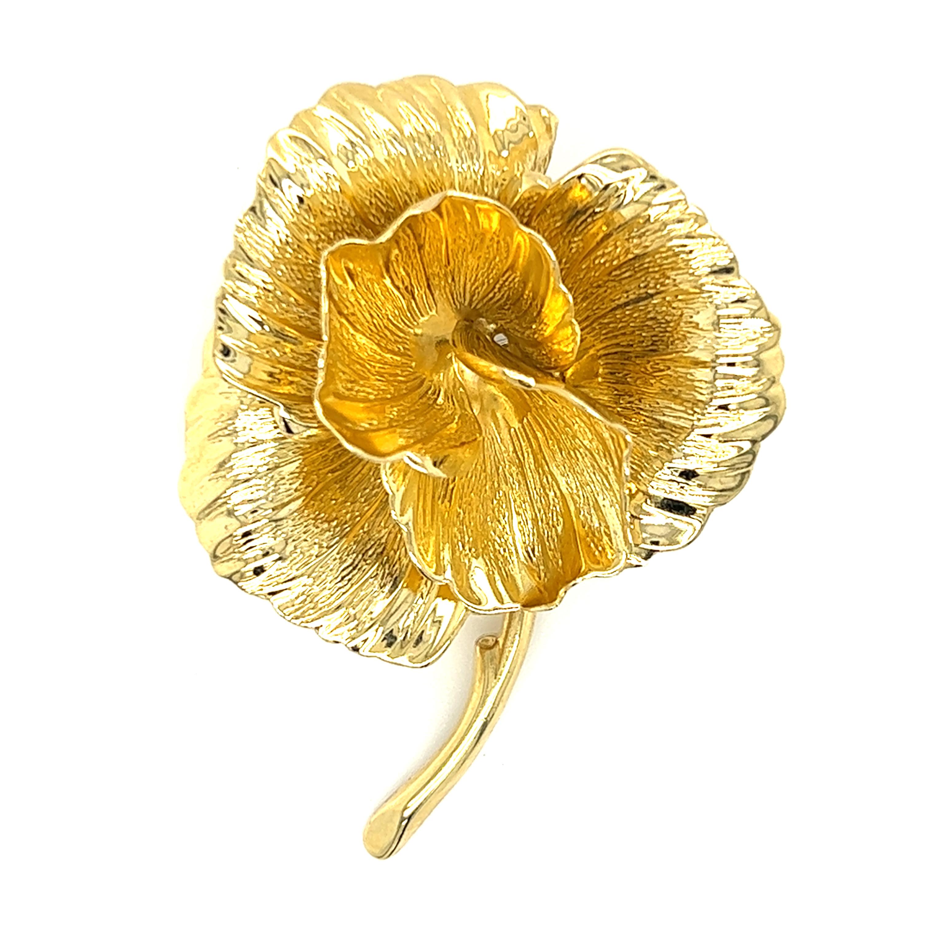  Created in 1965 by Henkel & Grosse Germany for Tiffany & Co., one 18K yellow gold modernist flower pin with bark and polished finish. The pin measures approximately two (2) inches long and 1.5 inches wide, complete with a traditional pin closure.
