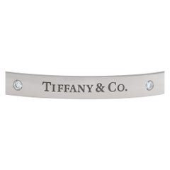 Tiffany & Co. Hinged Bangle bracelet in 18k White Gold with 2 Diamonds.