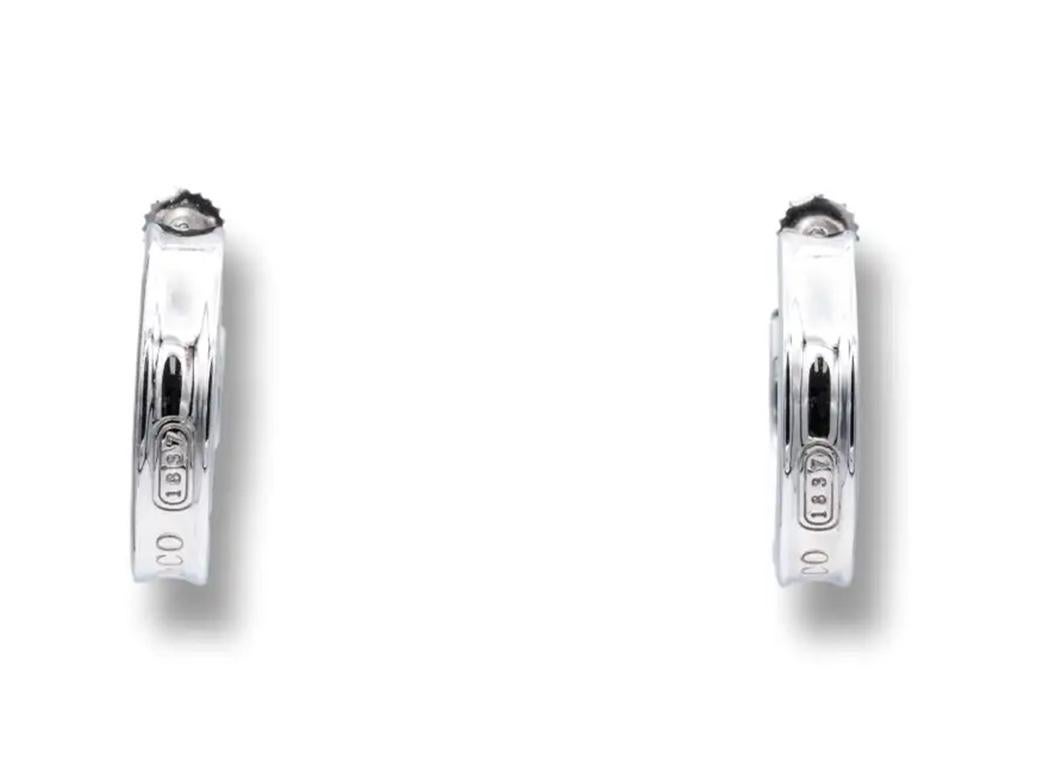 Tiffany & Co. T & Co. 1837 Hoop Earrings 1997 Sterling Silver 



Featuring 2 SENSATIONAL Tiffany Sterling Silver T & Co. 1837 Hoop Earrings 

Vintage Retired Earrings 

Comes With Tiffany Box and Pouch 

Stylish Desirable Earrings 

100% Genuine
