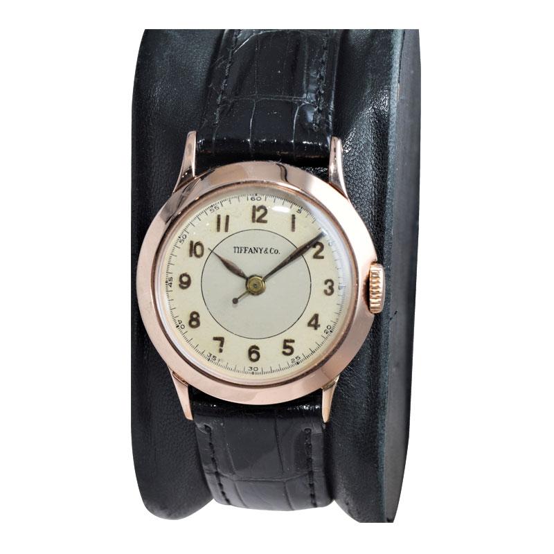 FACTORY / HOUSE: International Watch Company for Tiffany & Company
STYLE / REFERENCE: Round, Classic 
METAL: 14 Kt. Rose Gold
CIRCA: 1930's
MOVEMENT / CALIBER: Manual Winding / 17 Jewels / Sweep Seconds 
DIAL / HANDS: Silver with Arabic Applied