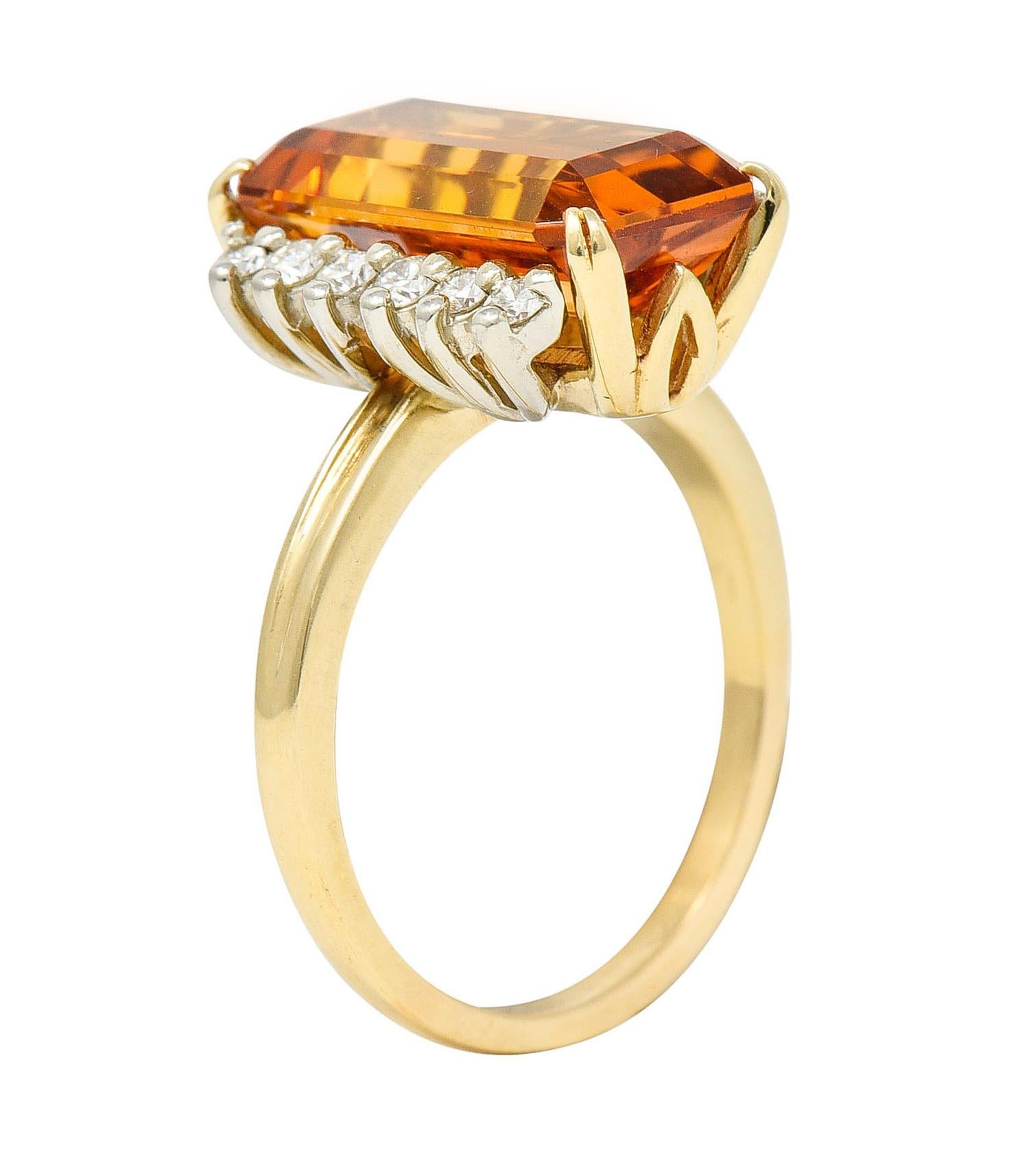 Featuring an emerald cut imperial topaz weighing approximately 6.15 carats

Set by split prongs and exhibits slightly peachy saturated orange color

Flanked by two rows of round brilliant cut diamonds - set in platinum

Weighing in total