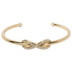 Tiffany
Co. Infinity Diamond Bangle in 18 Karat Yellow Gold 0.39 Carat Tiffany
Co. Infinity Diamond Bangle in 18 Karat Yellow Gold 0.39 Carat