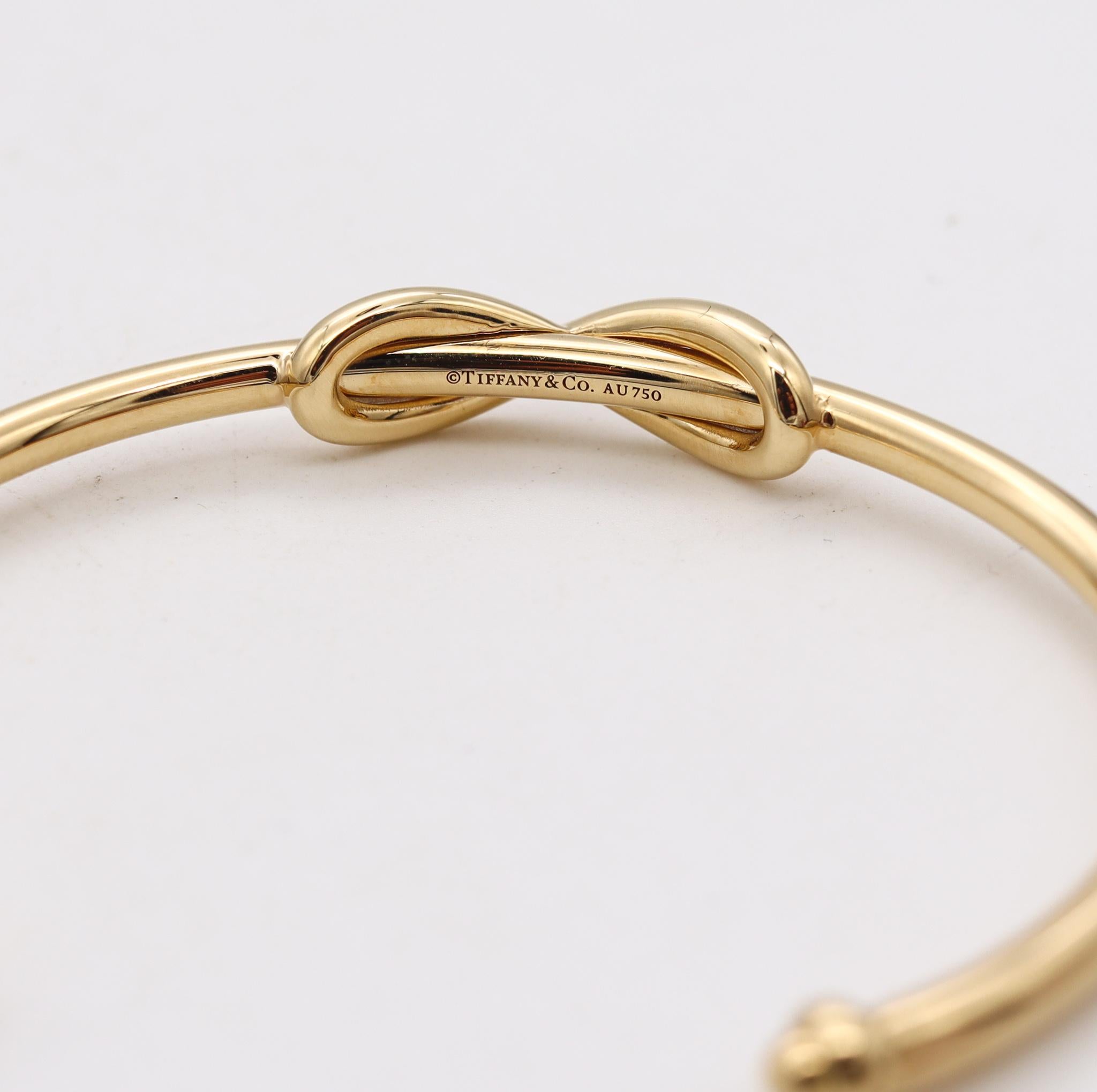 Modernist Tiffany Co Infinity Motif Cuff Bracelet In Solid 18Kt Yellow Gold With Boxes For Sale