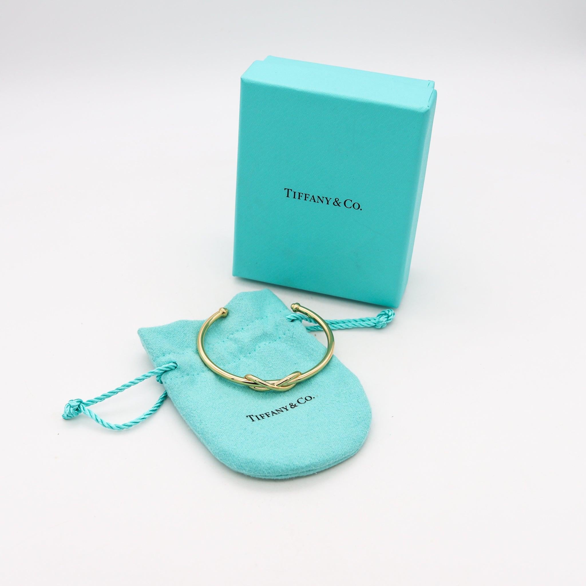 TIFFANY & CO. Manschettenarmband mit Unendlichkeitsmotiv aus massivem 18 Karat Gelbgold mit Schachteln 1