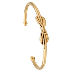 Manschettenarmband mit Unendlichkeitsmotiv von Tiffany Co. aus massivem 18 Karat Gelbgold mit Schachteln