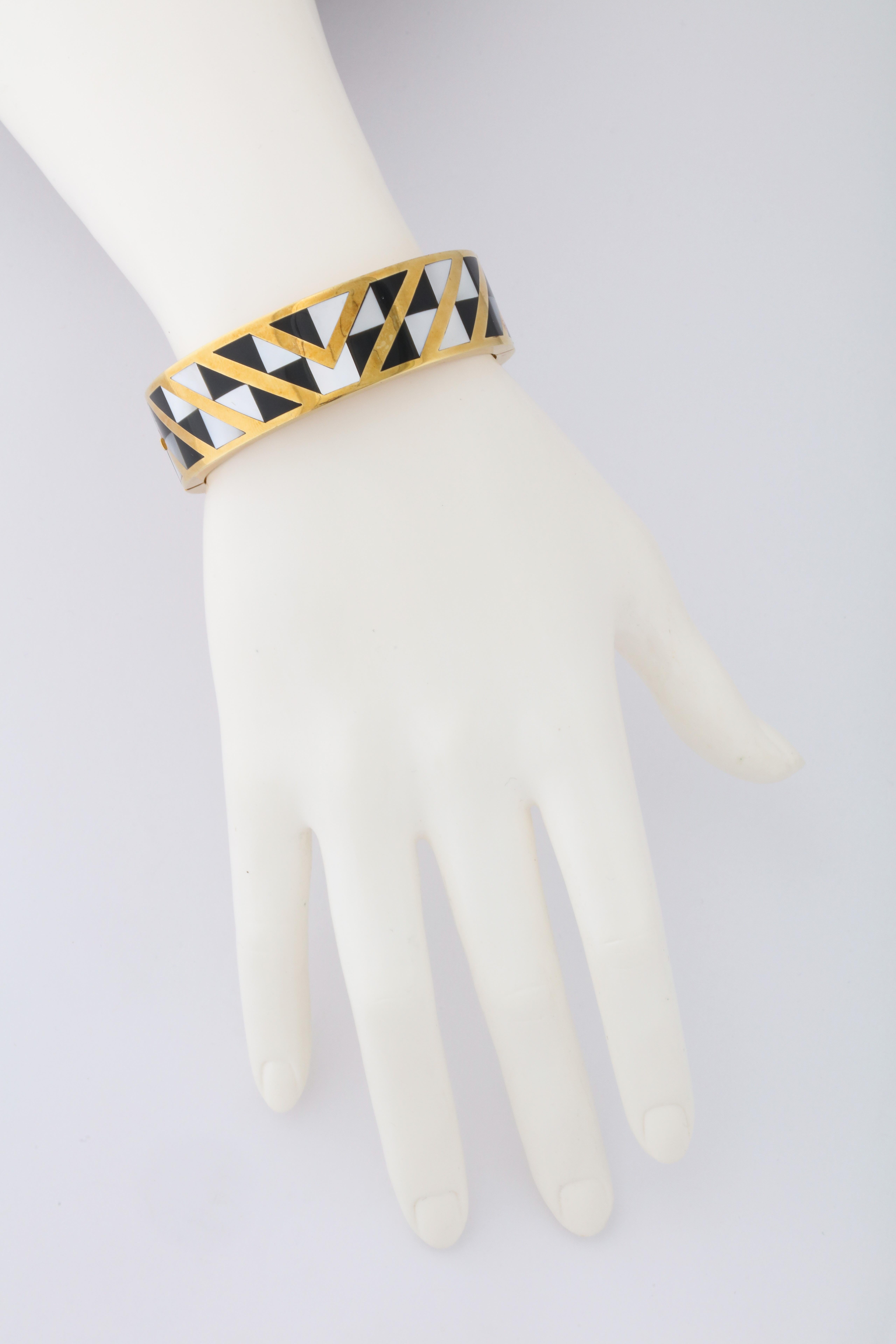 Chic contrast and geometric design in 18kt yellow gold with inlaid black onyx and white mother of pearl.  These designs were introduced to Tiffany and Co. by the designer Angela Cummings in the 1970s, and they remain an iconic Tiffany look. 