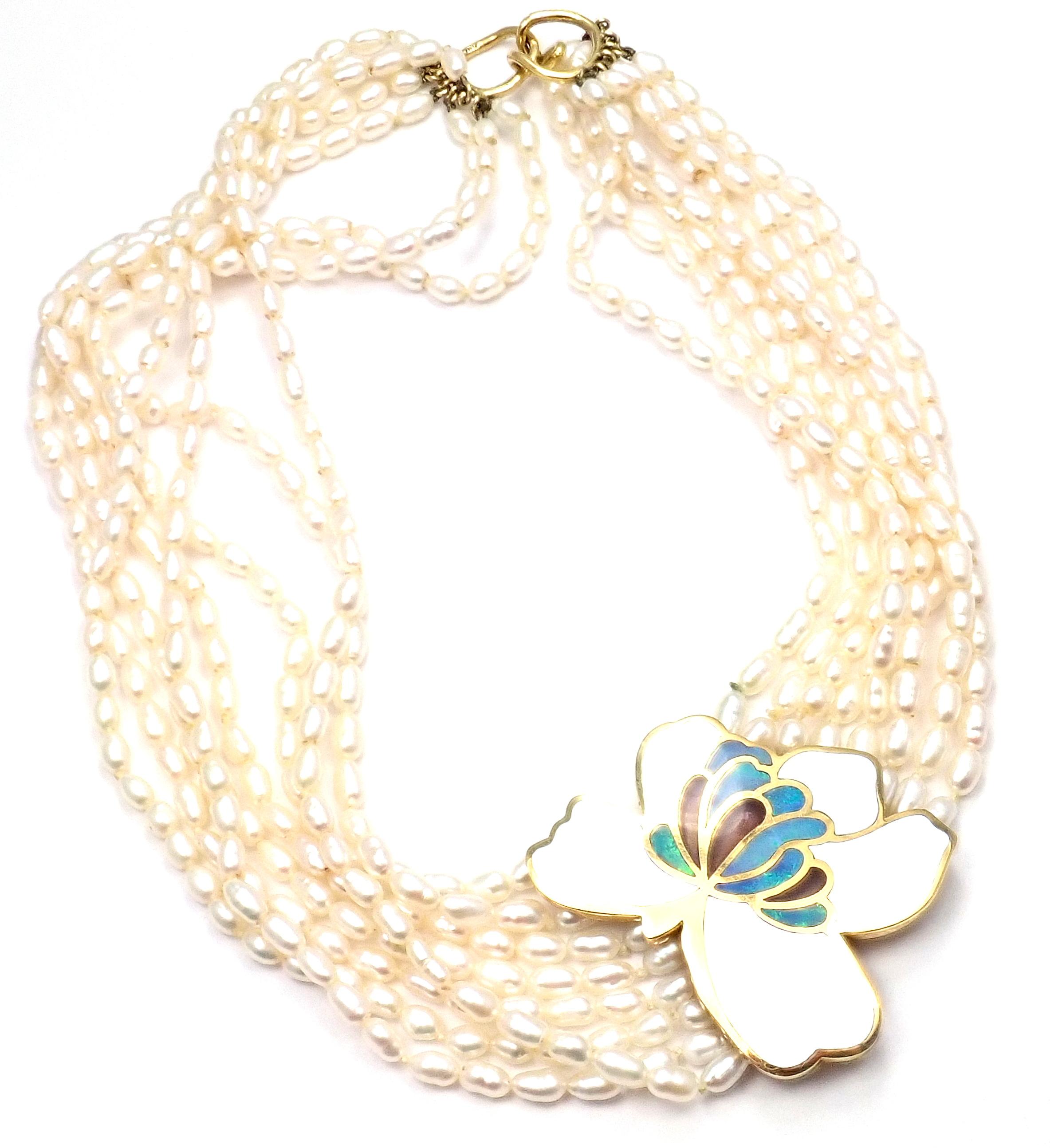 18k Yellow Gold Inlaid Mother Of Pearl, Opal, Black Jade Flower Pendant Necklace by 
Tiffany & Co.
With Inlaid Mother Of Pearl, Opal, Black Jade
And 8 rows of 4.5mm fresh water pearls
Details: 
Weight: 101.9 grams
Length: 17