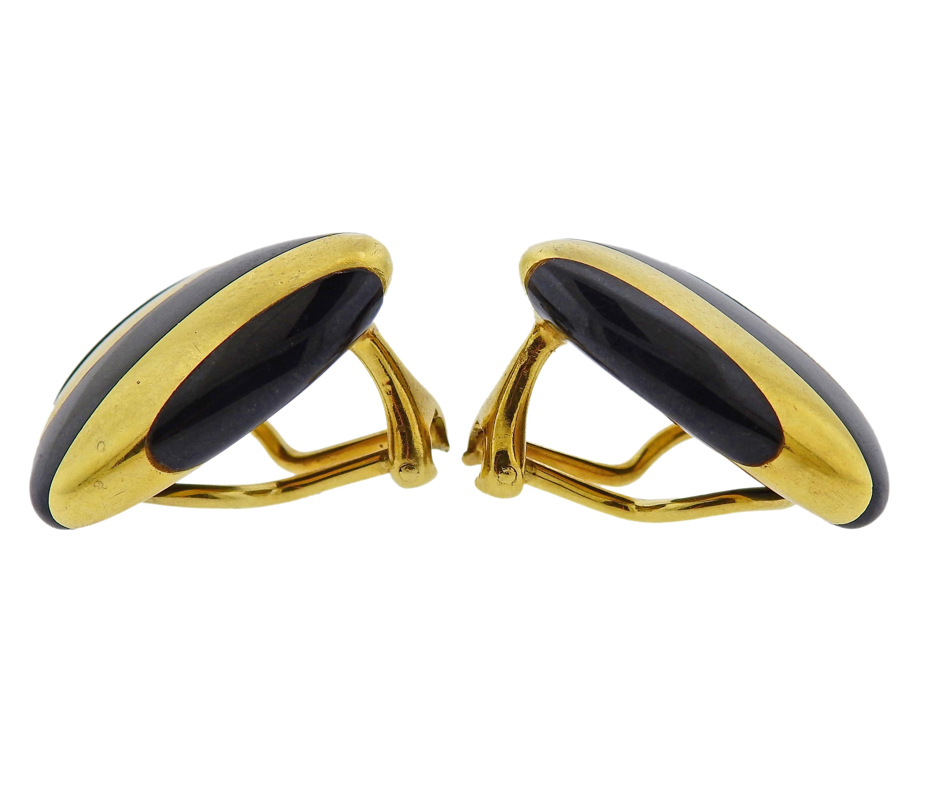 Pair of vintage 18k gold triangle earrings by Tiffany & Co, set with black jade inlay stripes. Measure 22mm x 19mm. Marked T & Co, C, 18k. Weigh 15.7 grams.

SKU#E-02996