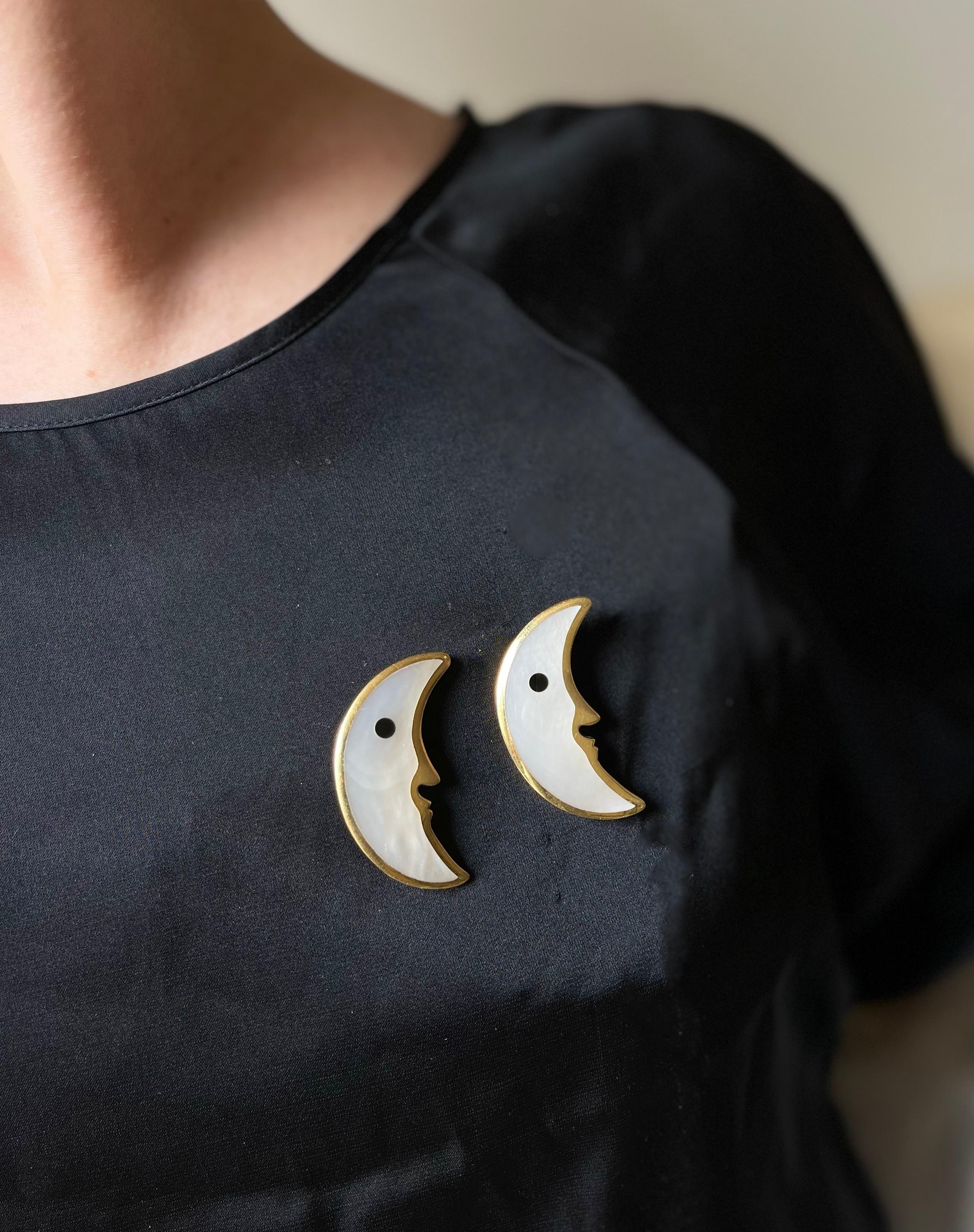 Set of two 18k gold half moon brooches by Tiffany & Co, crafted with mother of pearl inlay and onyx eyes. Each brooch measures 1.75