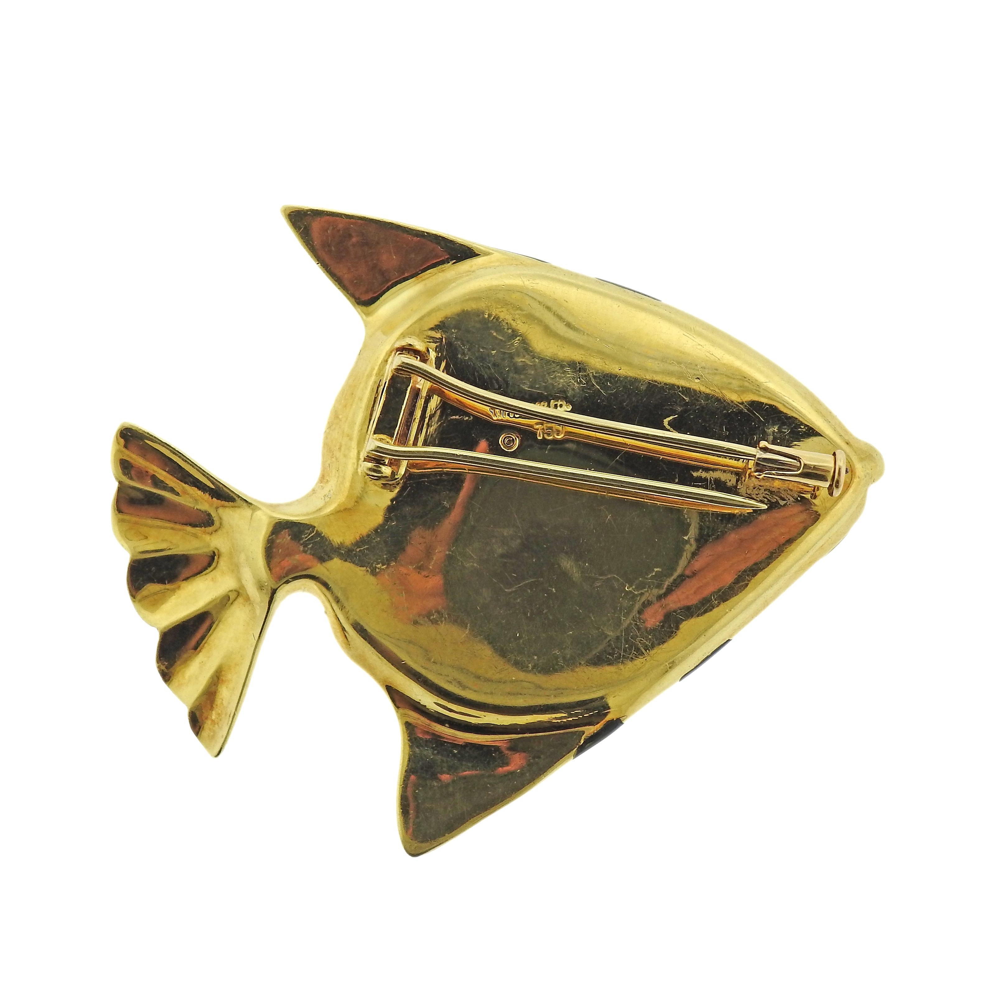 18k gold fish brooch, by Tiffany & Co, set with inlay mother of pearl, onyx and lapis. Brooch measures 2.25