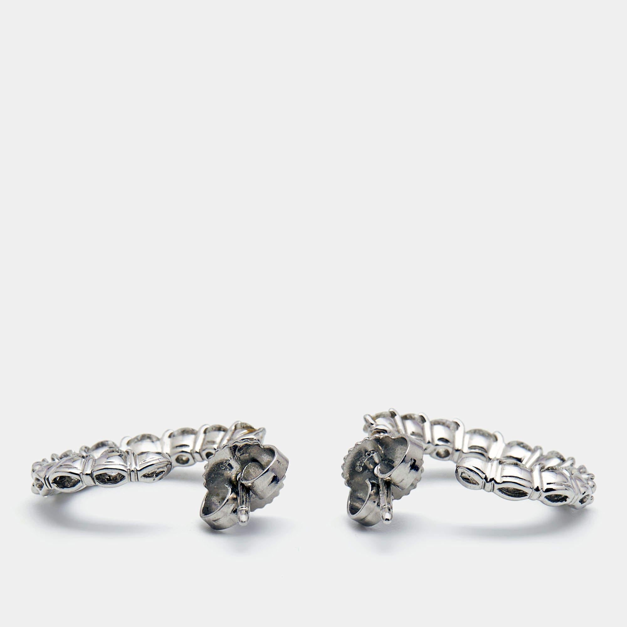 This incredible pair of earrings from Tiffany & Co. has been created by the brand's skilled craftsmen with such precision that every line and curve is smoothened to perfection. The earrings are sculpted using precious 18k white gold and added with