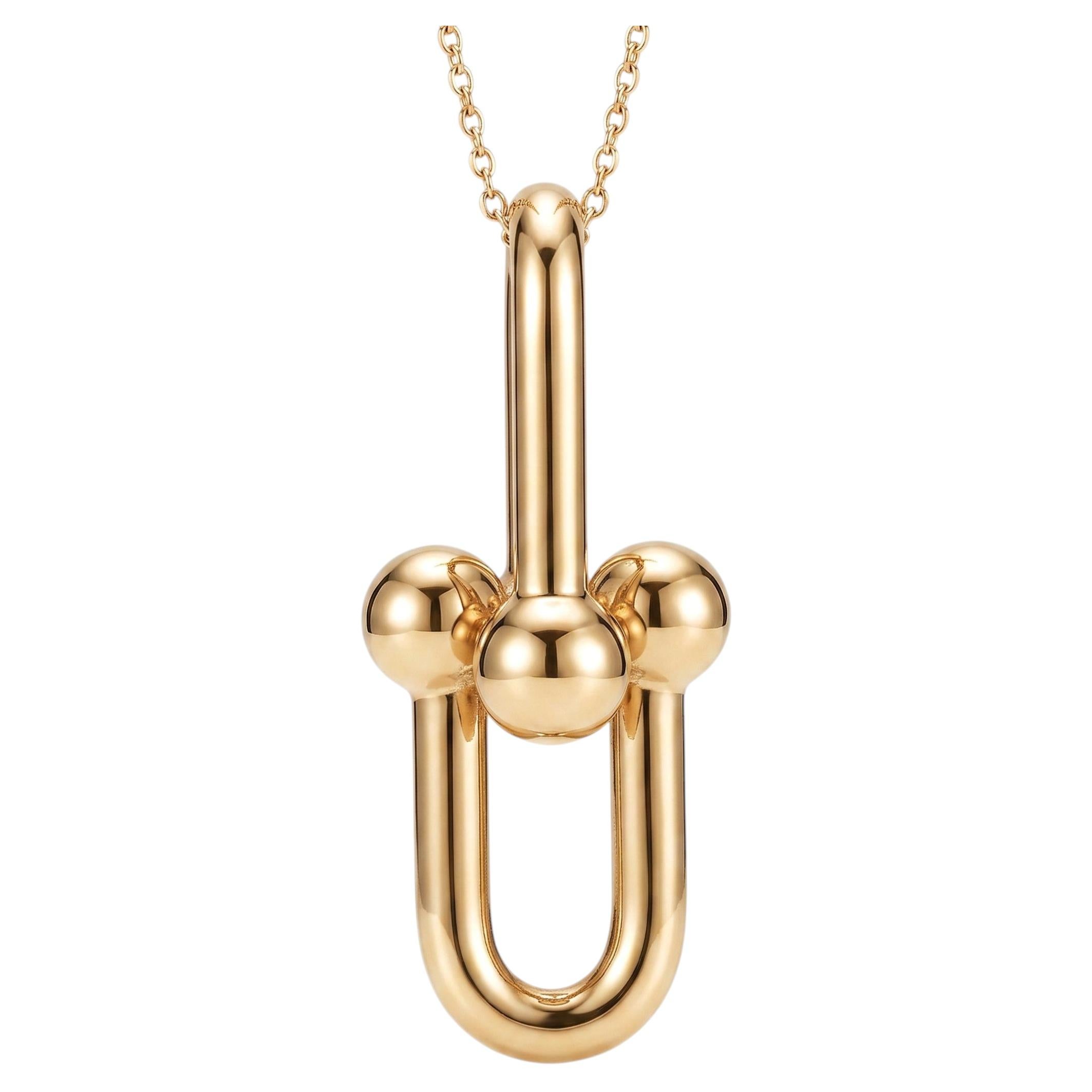 Tiffany & Co. Collier à pendentif entrelacé, pendentif en or jaune 18 carats