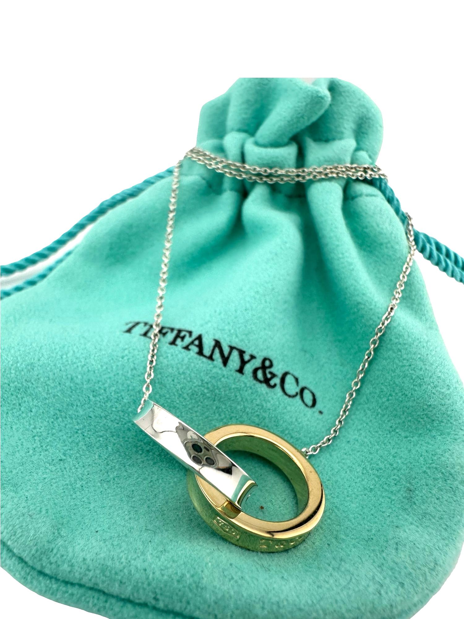 Tiffany & Co 1837 Interlocking Circles Pendant
Style:  Pendant Necklace
Ref. number:  60013936
Metal:  Sterling Silver & 18k Yellow Gold
Size / Measurements:  16' Inches
Hallmark:  750 T&Co 1837 on gold ring - 925 T&Co1837 on silver ring -