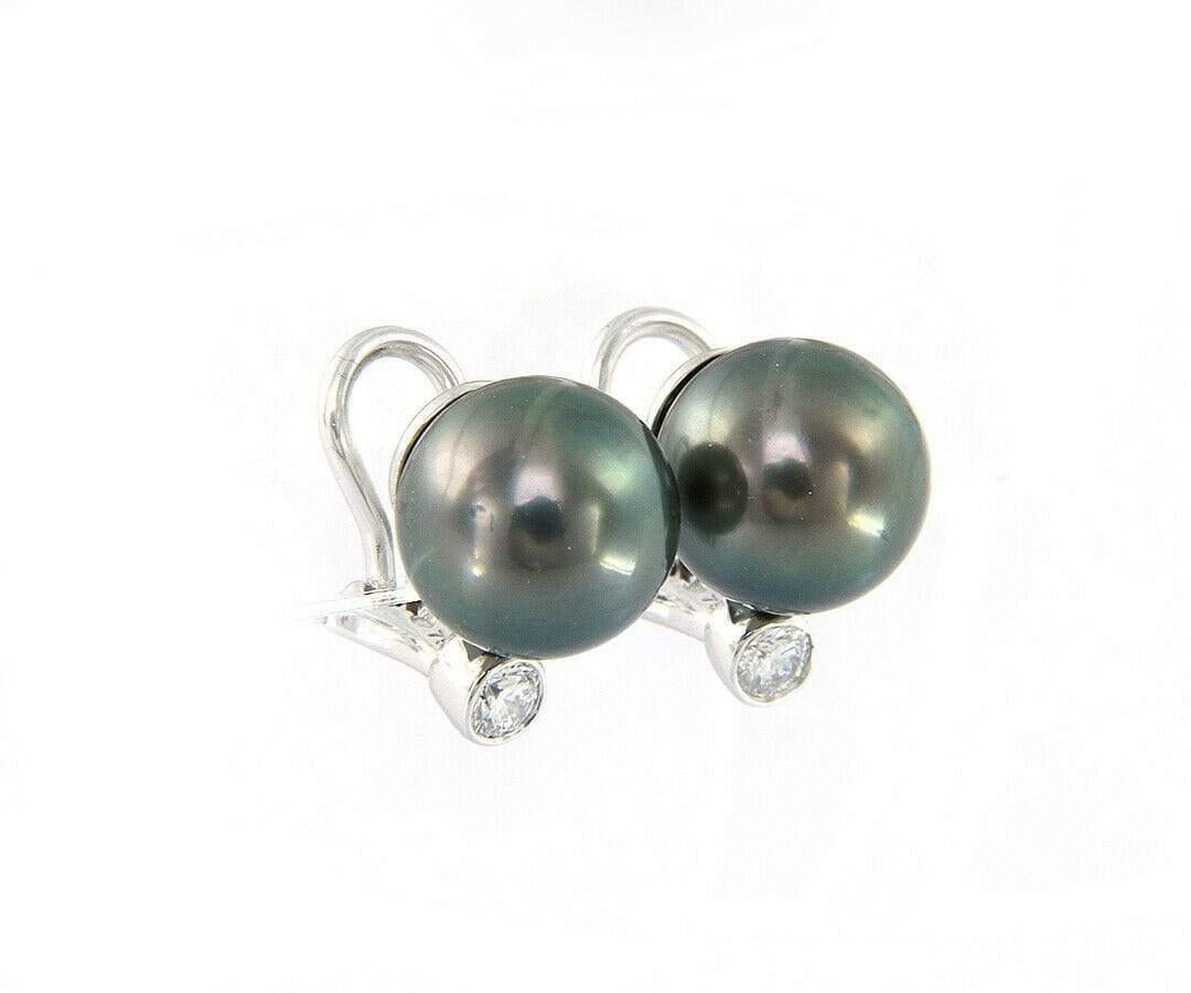Tiffany & Co. Iridesse Tahitian Pearl and Diamond Earrings in 18K

Tiffany & Co. Iridesse Tahitian Pearl and Diamond Earrings
18K White Gold
Pearl Size: Approx. 11.0 MM
Diamonds Carat Weight: Approx. 0.42ctw
Clarity: VS2
Color: F
Weight: Approx.