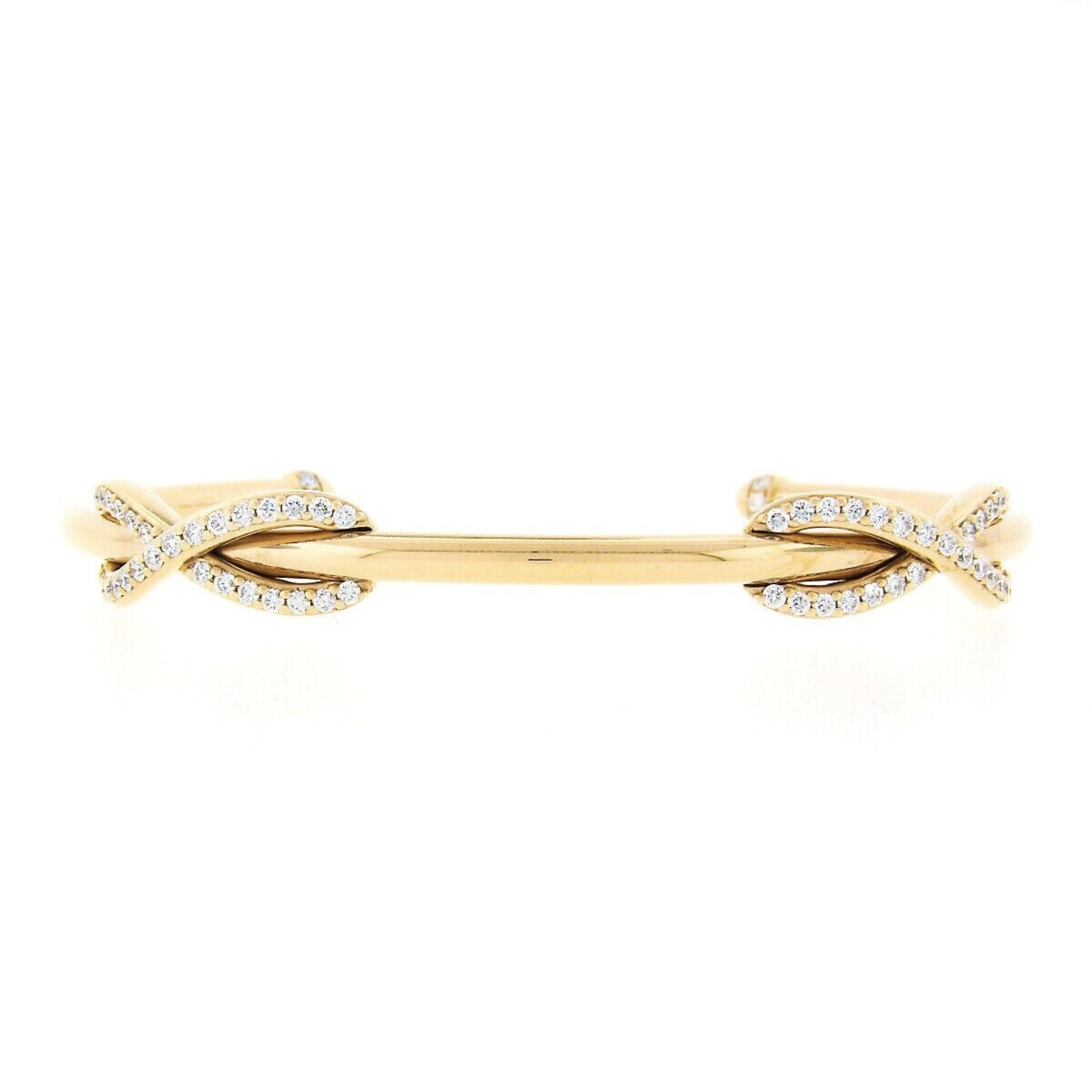 This gorgeous Tiffany & Co. cuff bracelet was crafted in Italy from solid 18k rose gold. It features two beautiful infinity designs at its top in which are covered in very fine quality diamonds that display spectacular sparkle and bring a truly