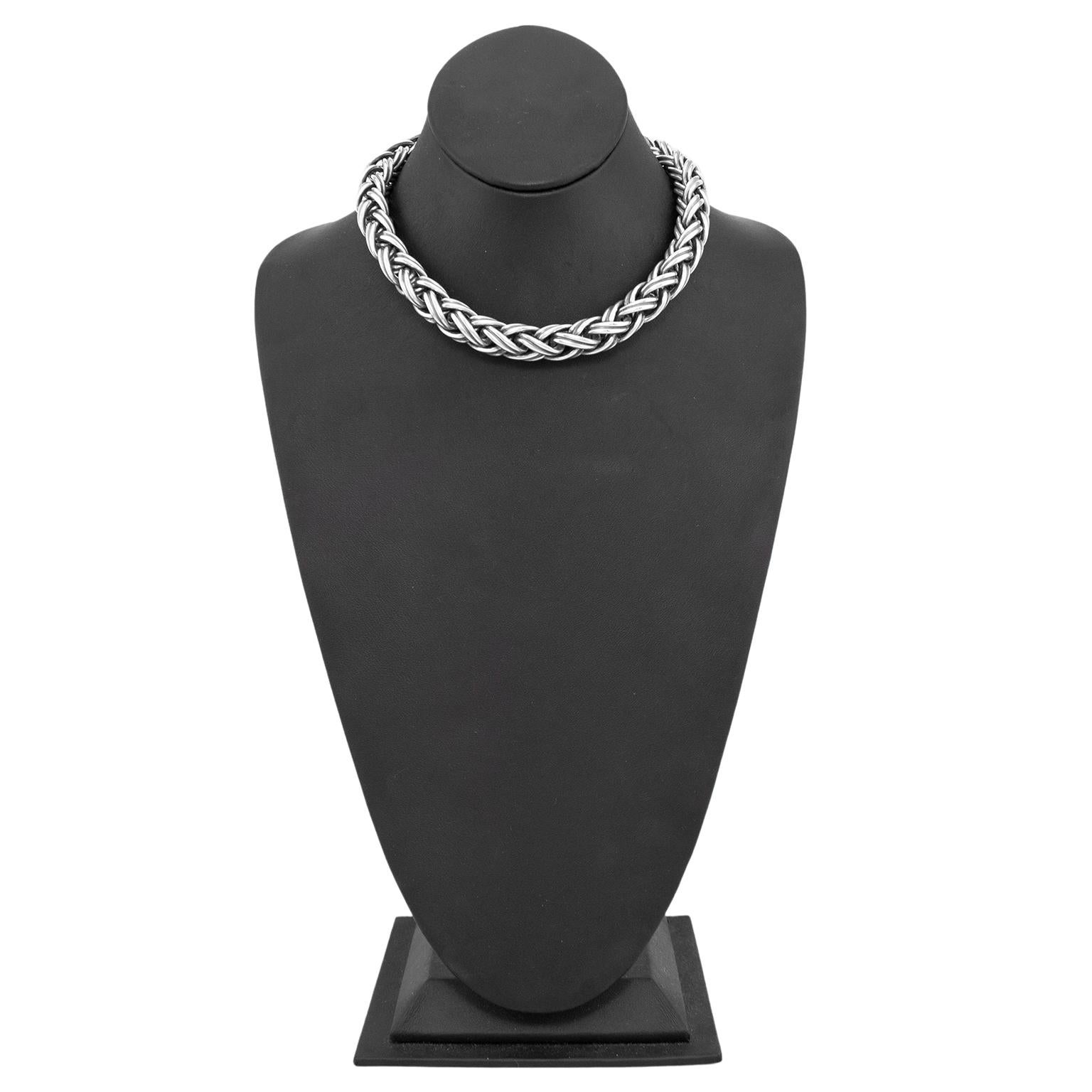 Stunning Tiffany & Co. sterling silver necklace dating from the 1980's. Looped rope chain linked together to create a braid like effect in a thick square shape. Measures 16