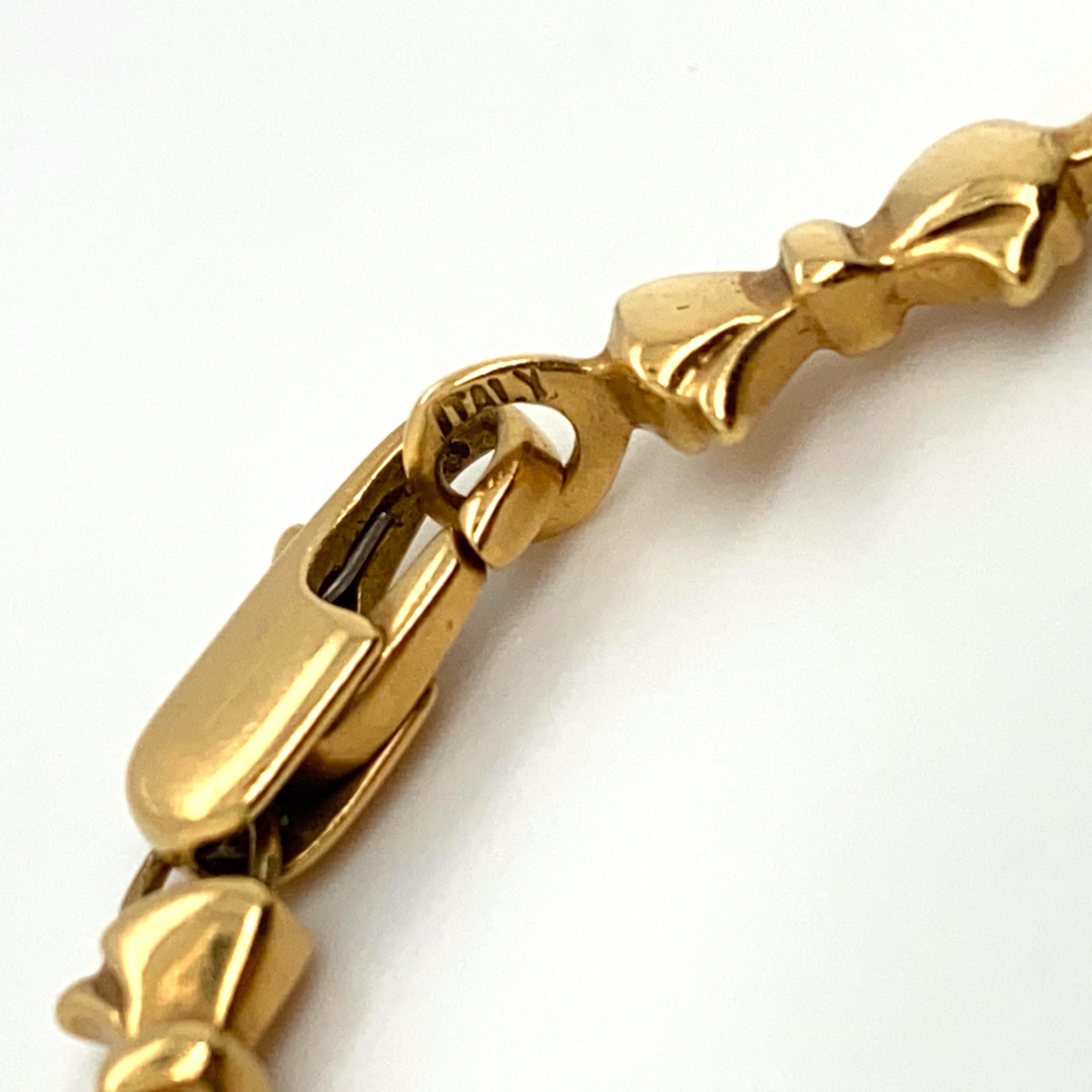 Tiffany & Co. Italy 18 Karat Heart and Bowtie Motif Link Bracelet For Sale 1