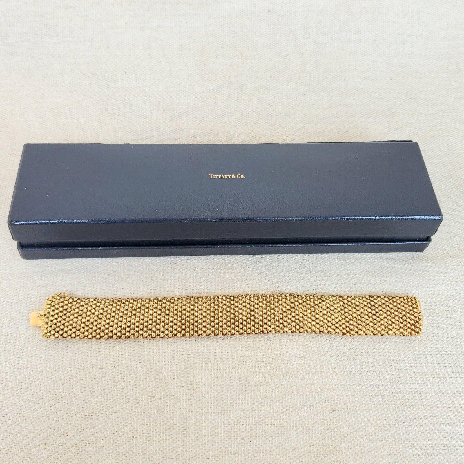 Tiffany & Co. Italy 18k Yellow Gold Bracelet w/Box Circa 1960s

Here is your chance to purchase a beautiful and highly collectible designer bracelet.  

Vintage Tiffany & Co. 18K Yellow Gold Beaded Mesh Bracelet 50.9 Grams with Tiffany Box (box