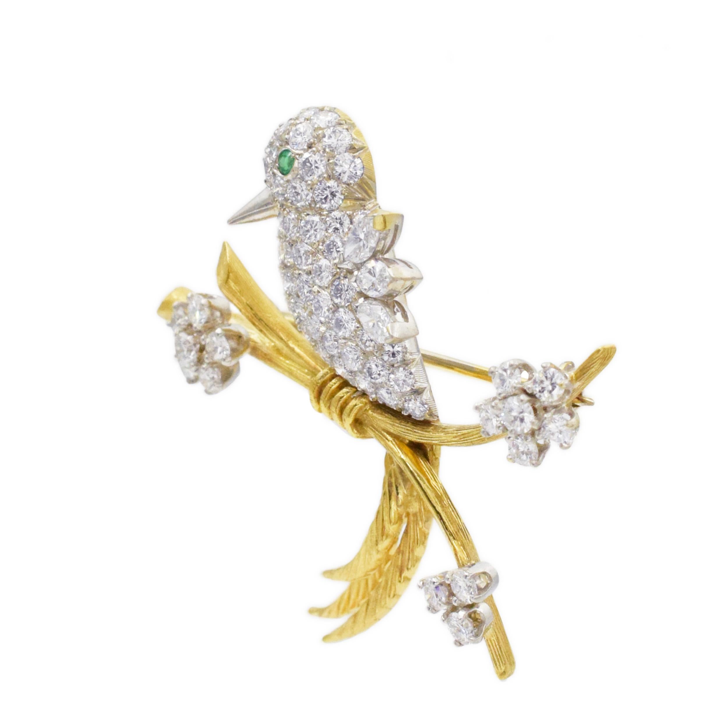 Tiffany Schlumberger diamond and emeradl bird on a branch brooch in 18k yellow gold and platinum.
The bird is made in platinum, body fully encrusted with round brilliant cut diamonds, wings made of three marquise cut diamonds and round cut emerald
