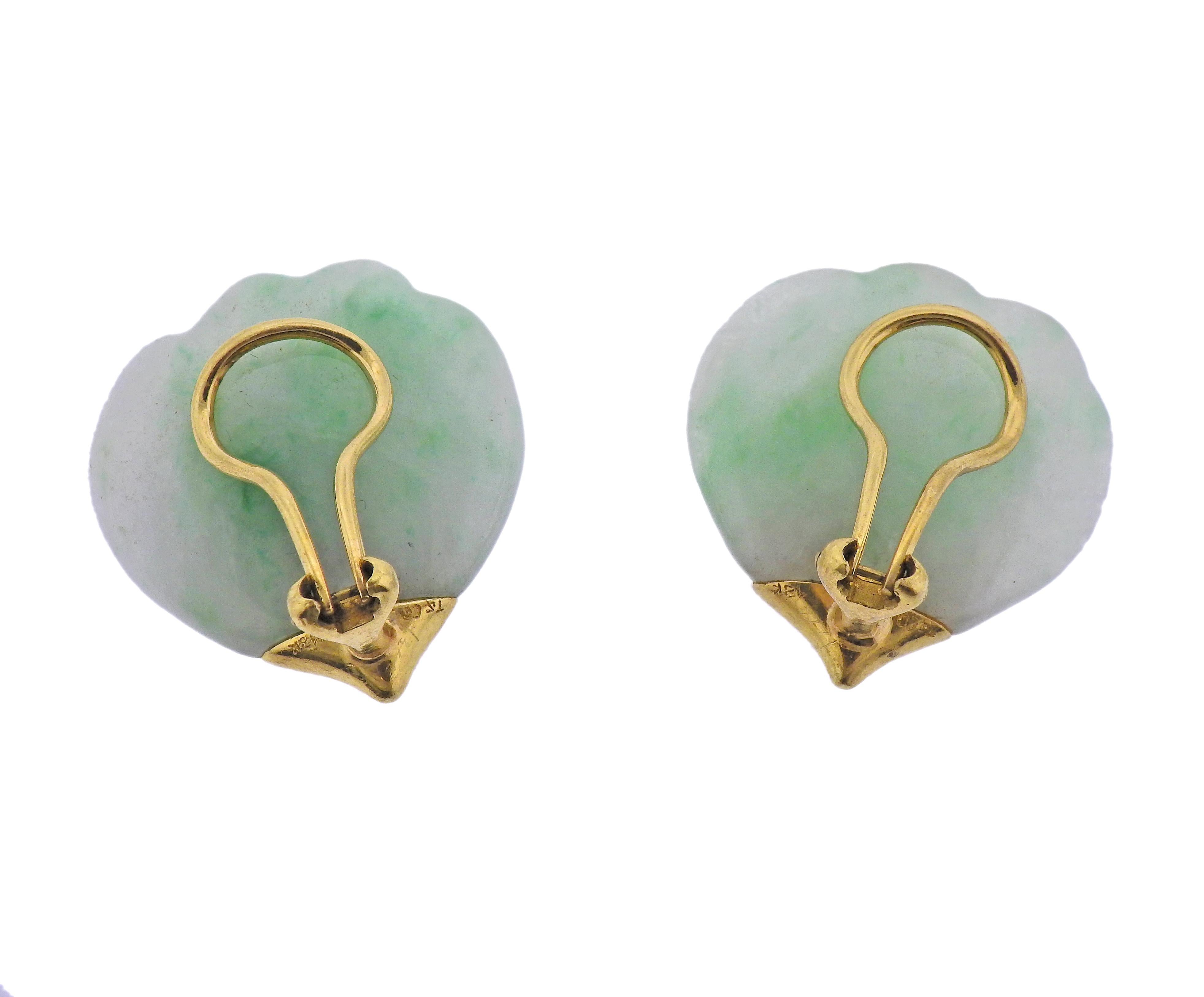 Pair of 18k yellow gold earrings by Tiffany & Co, with carved jade petals. Earrings are 26mm x 25mm. Marked: T & Co, 18k. Weight - 7.3 grams. 
