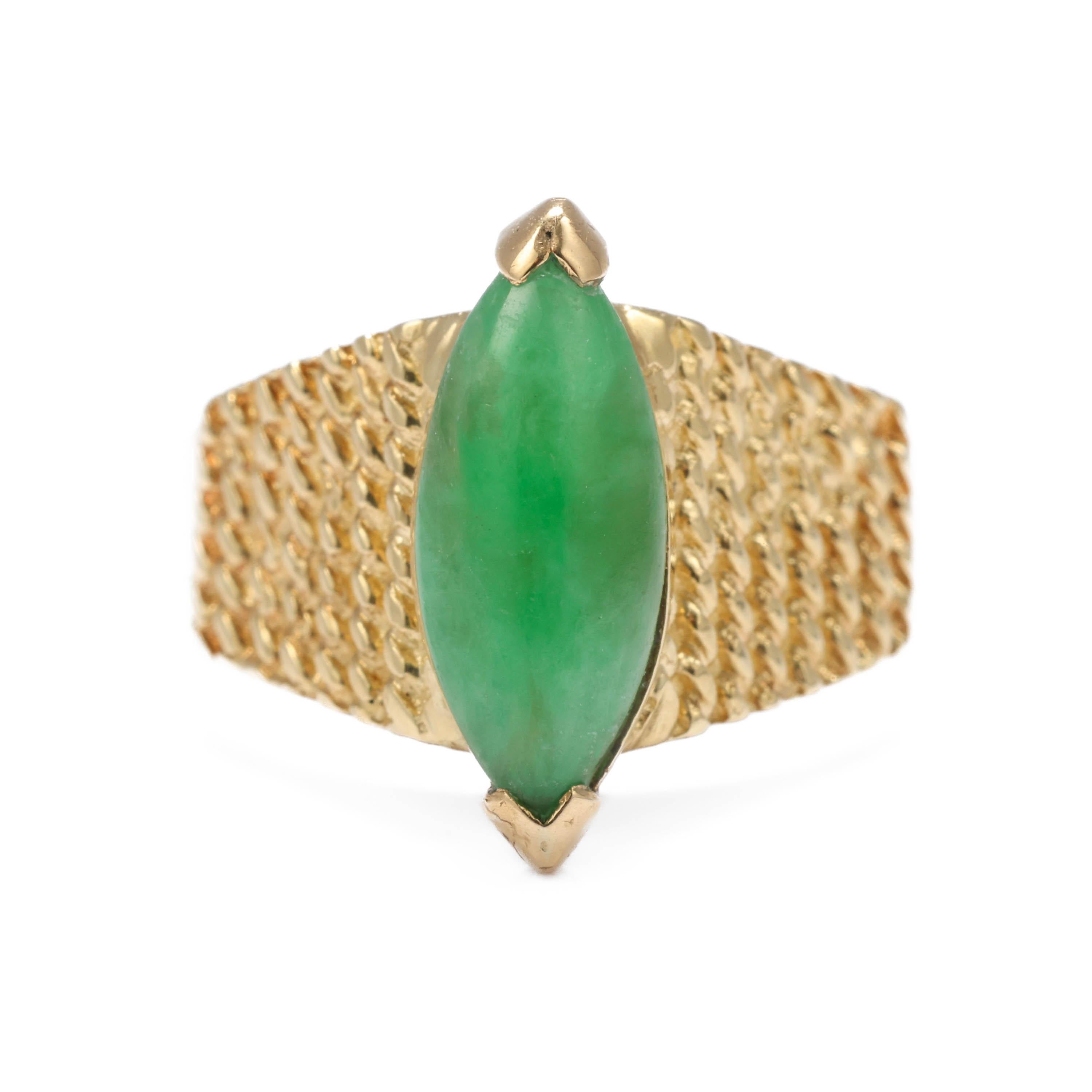 A gorgeous -and oh so rare- original Midcentury (circa 1950s-1960s) Tiffany & Co. Burmese jadeite jade and 18K yellow gold ring. Featuring a bright apple green navette shaped cabochon of natural and untreated Burmese jadeite jade with an old-school