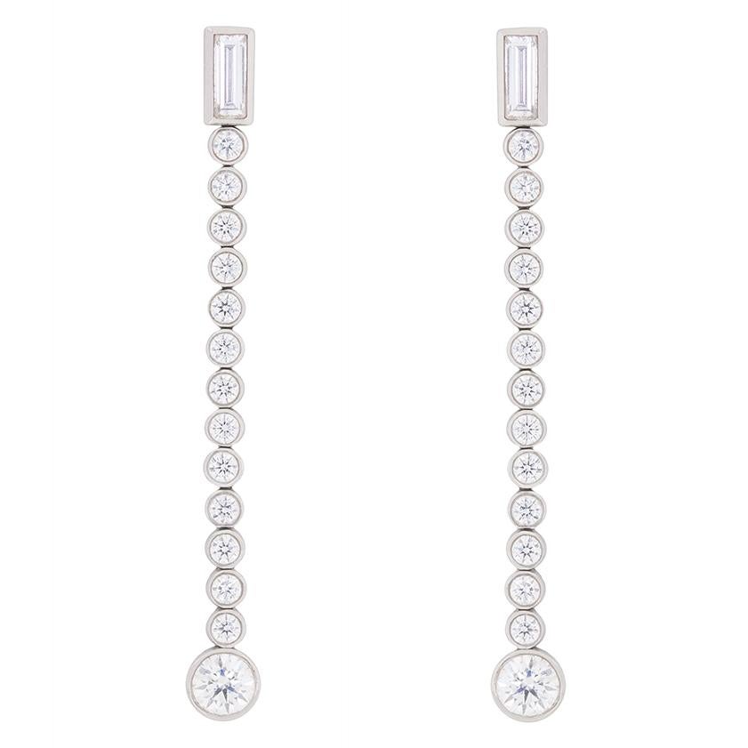 These hard to find diamond drop earrings are part of the Tiffany & Co. ‘Jazz’ collection, and have been discontinued.

Together, these stunning earrings glisten with 1.68 carats of F colour, VS clarity diamonds.  From a rub over set diamond