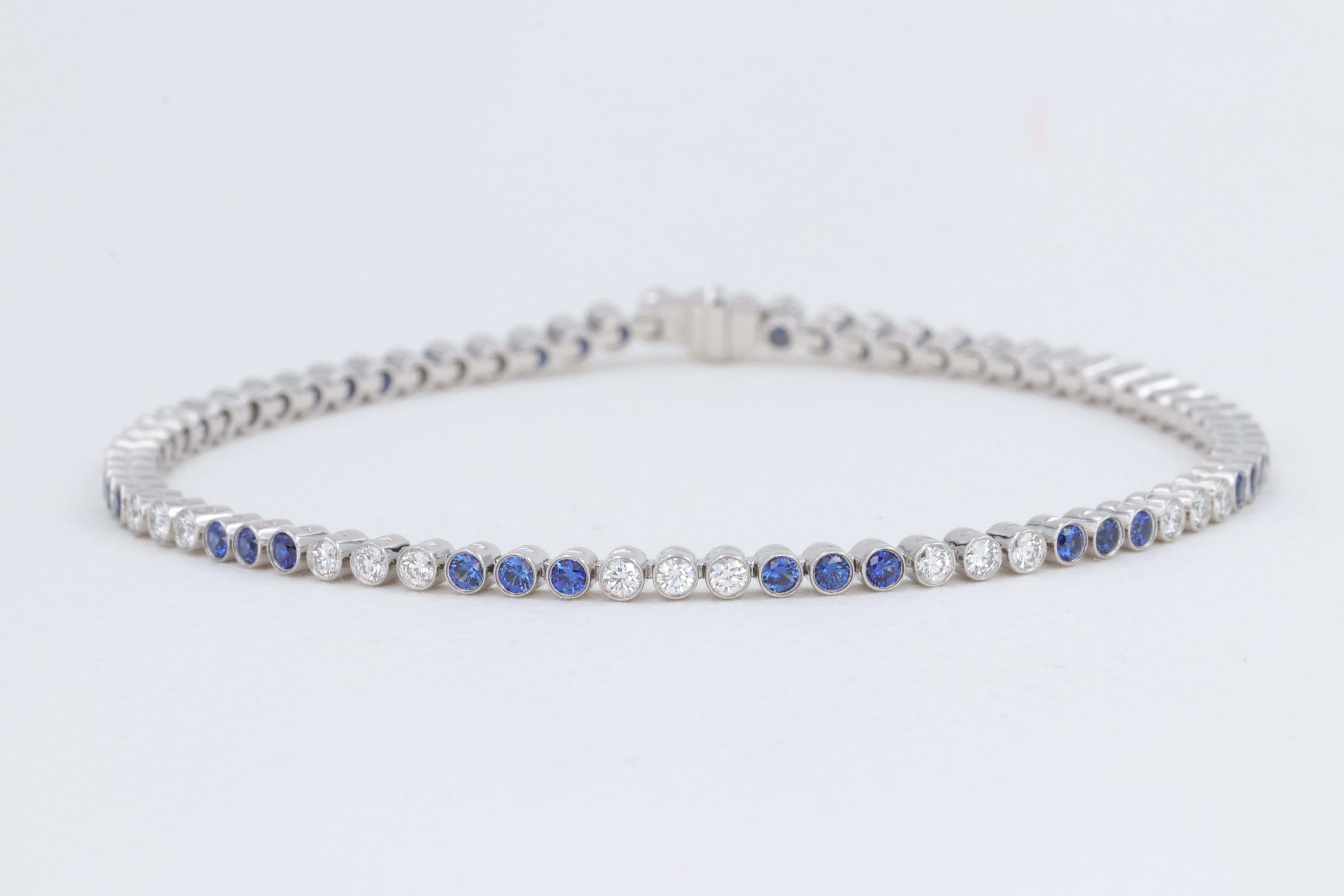 Tiffany & Co. Jazz Diamond and Sapphire Bezel Set Bracelet in Platinum in Box

Includes Original Tiffany & Co Bracelet Box

Stones:

Diamonds - 36 = 0.70ctw 
Color - D to F
Clarity - VS+

Sapphires - 36 = 0.85ctw 
Color - Vivid Blue 
Clarity - Eye