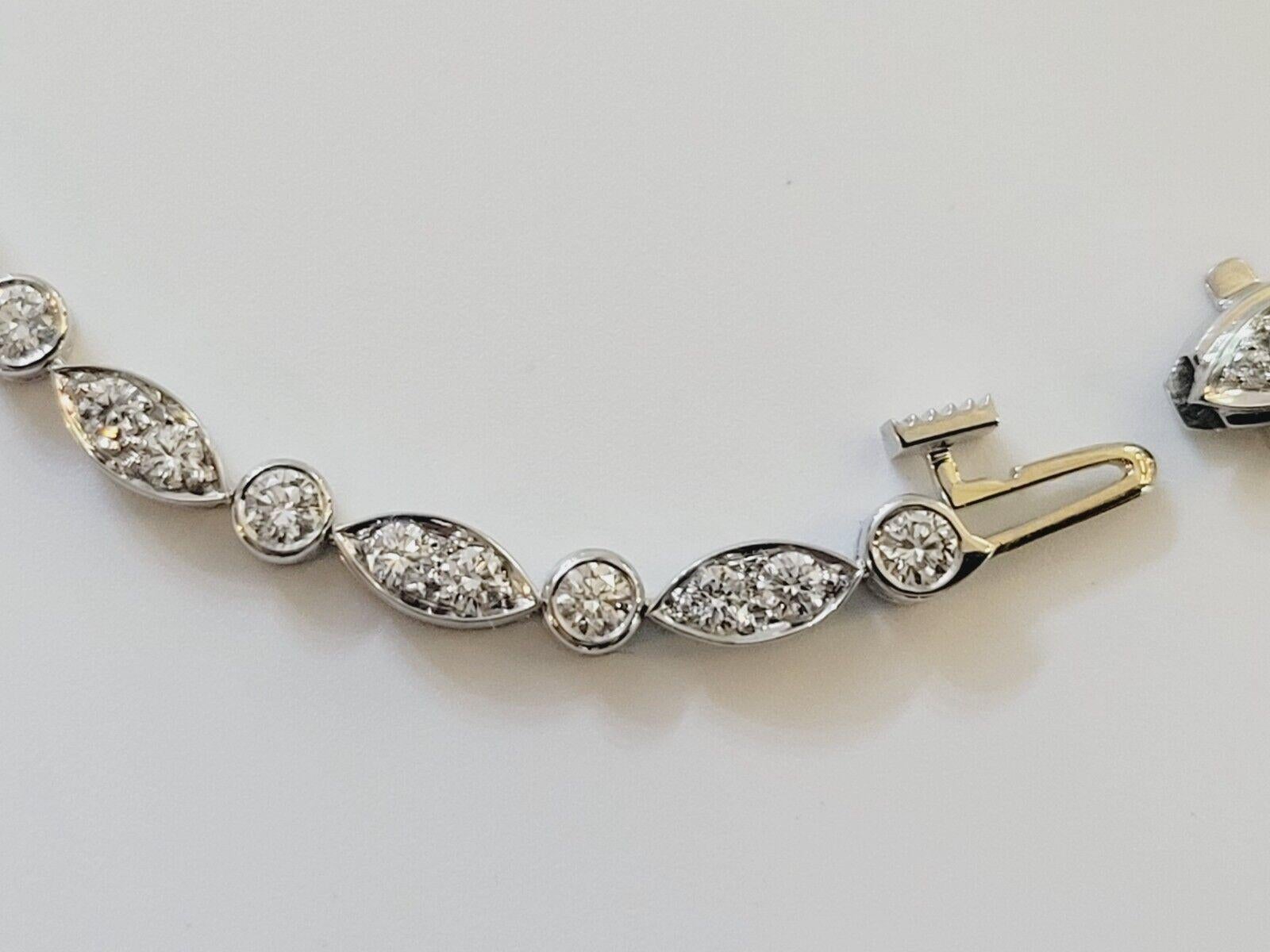  Excellent condition.
Tiffany Co Jazz Diamond Platinum Bracelet.
1.60 Ct in total 
Length: 7 inch
Width: 3 mm
Weight: 11 gram
White Round Brilliant Diamonds 
Color: F 
Comes with original Tiffany Box

