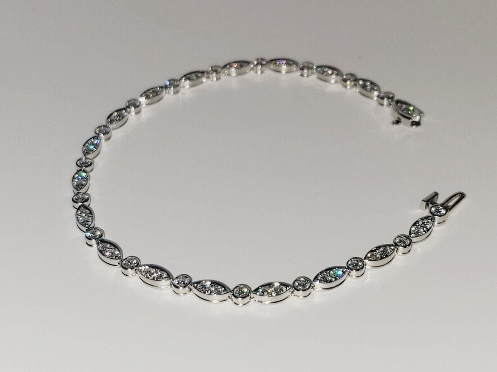 Excellent condition.
Tiffany Co Jazz Diamond Platinum Bracelet.
1.60 Ct in total 
Length: 7 inch
Width: 3 mm
Weight: 11 gram
White Round Brilliant Diamonds 
Color: F 
Comes with original Tiffany Box