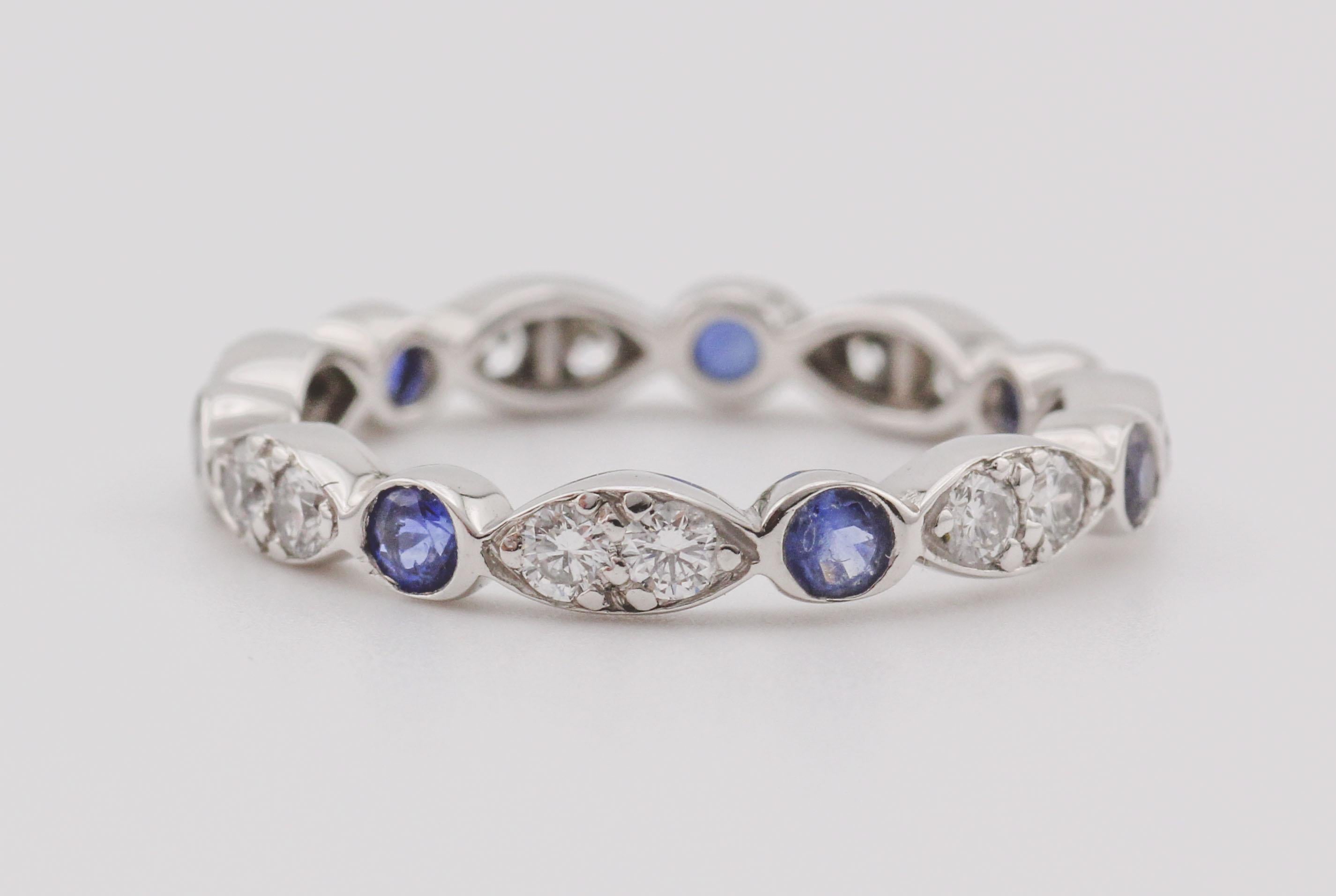 Celebrate refined elegance and rhythmic beauty with the Tiffany & Co. Jazz Diamond and Sapphire Eternity Band, a dazzling piece that captures the harmony of color and brilliance in a continuous loop of luxury. Crafted in luminous platinum, this