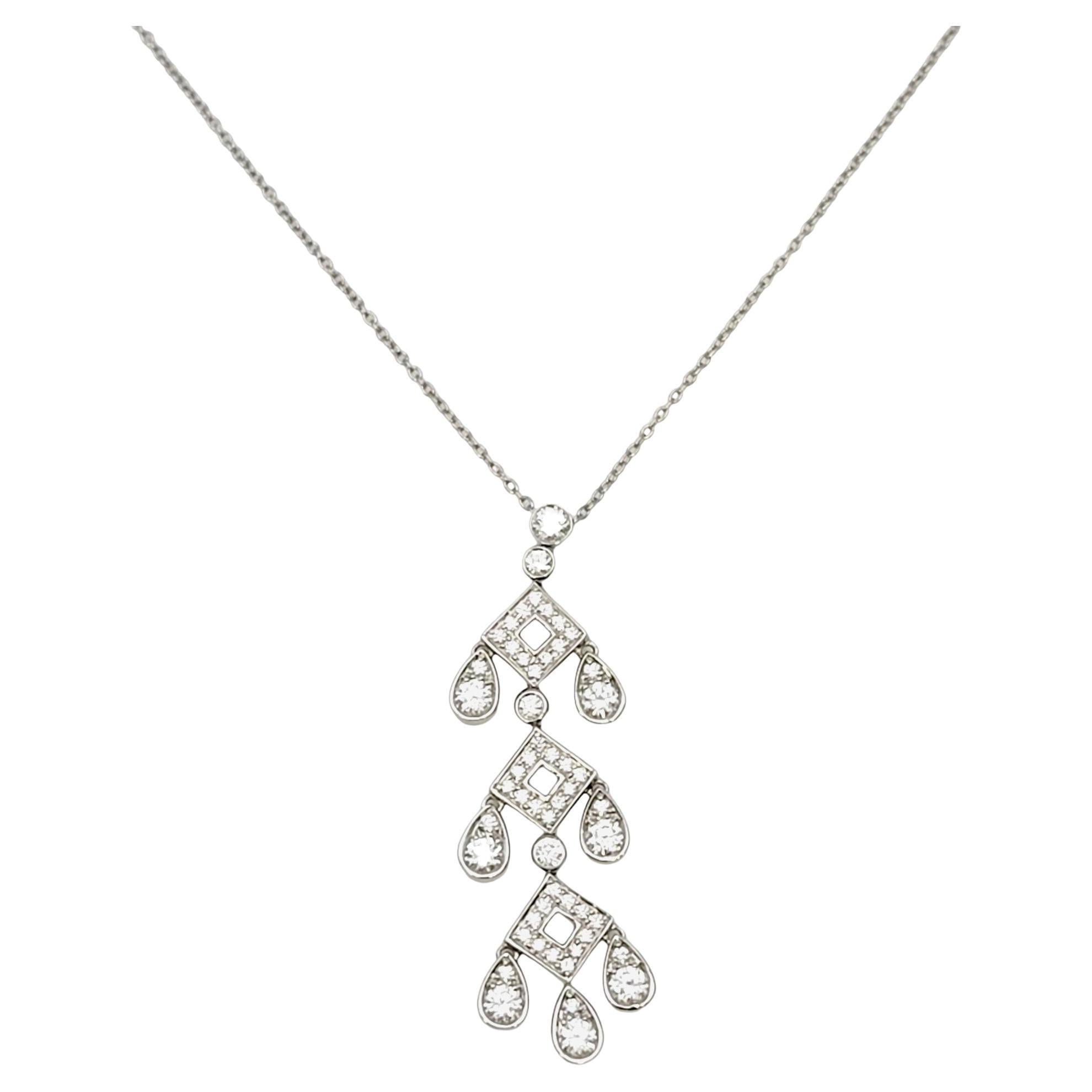 This sparkling Tiffany & Co. Jazz Pagoda diamond drop necklace is absolutely beautiful. The delicate platinum chain and glittering drop of natural round diamonds goes with just about everything. Three open diamond shaped links hang down in an