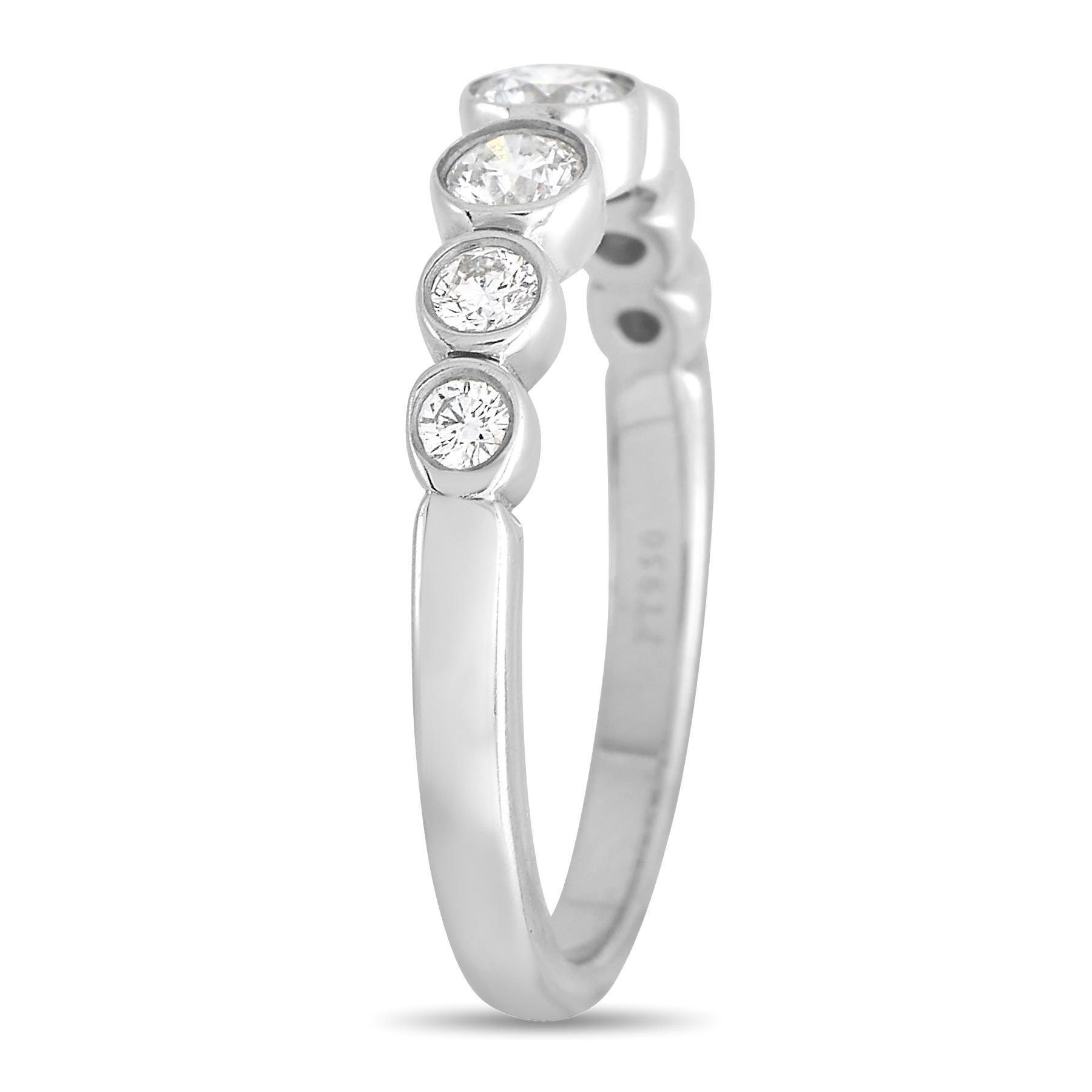 This Tiffany & Co. Jazz ring is incredibly sophisticated in design. A pure platinum setting with a band width and top height measuring 2mm provides the perfect backdrop for this piece’s sparkling diamonds, which total 0.31 carats and sit within a