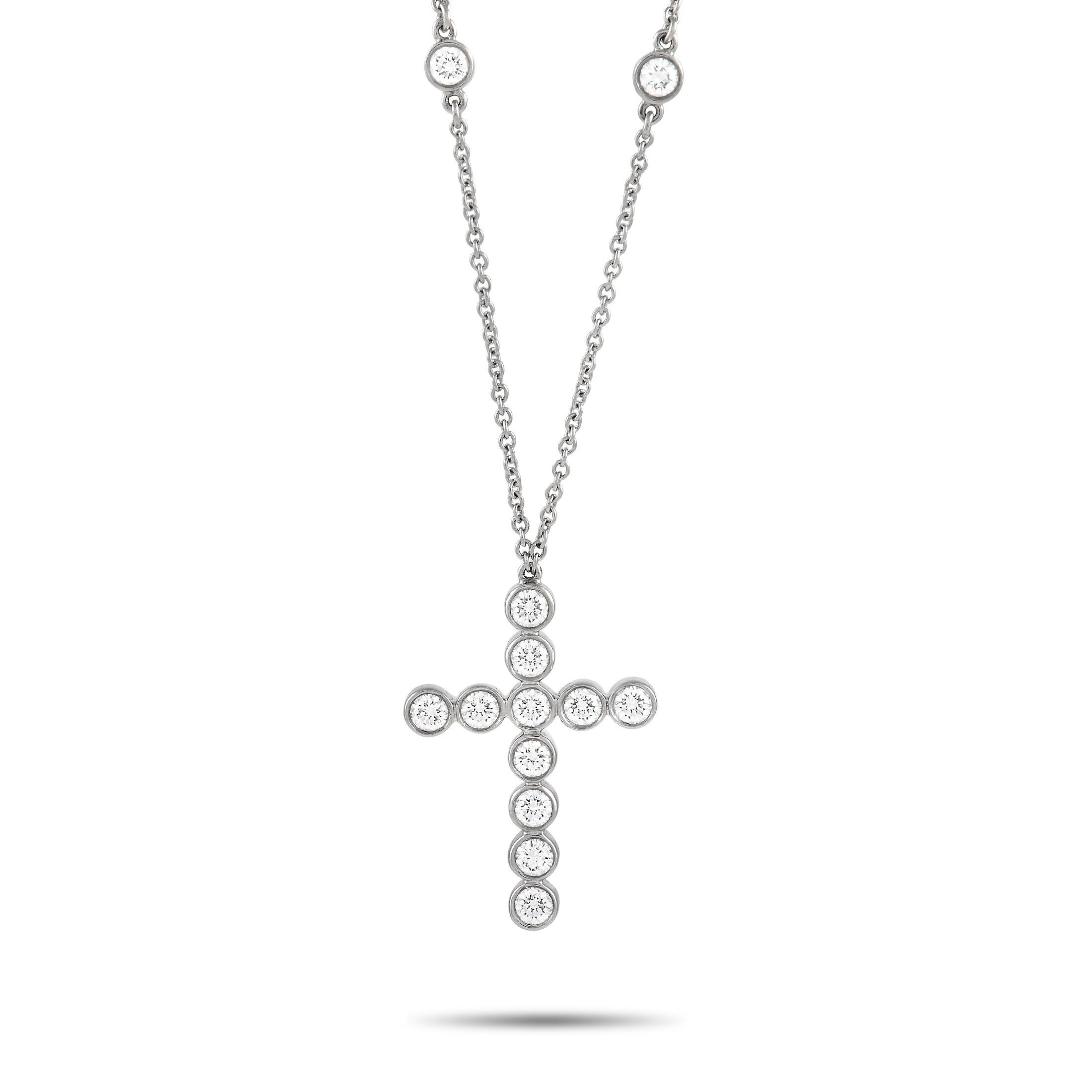 Keep faith close to your heart with this Tiffany & Co. Jazz Platinum 0.90 ct Diamond Cross Pendant Necklace. It features a 16-inch long chain holding a cross-shaped pendant of about an inch in size. The pendant comes adorned with 11 diamonds on