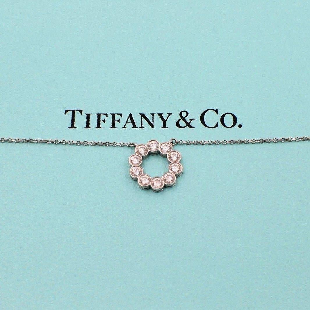 Tiffany & Co.
Style:  Jazz Circle
Metal:  Platinum PT950
Length:  Chain is 16